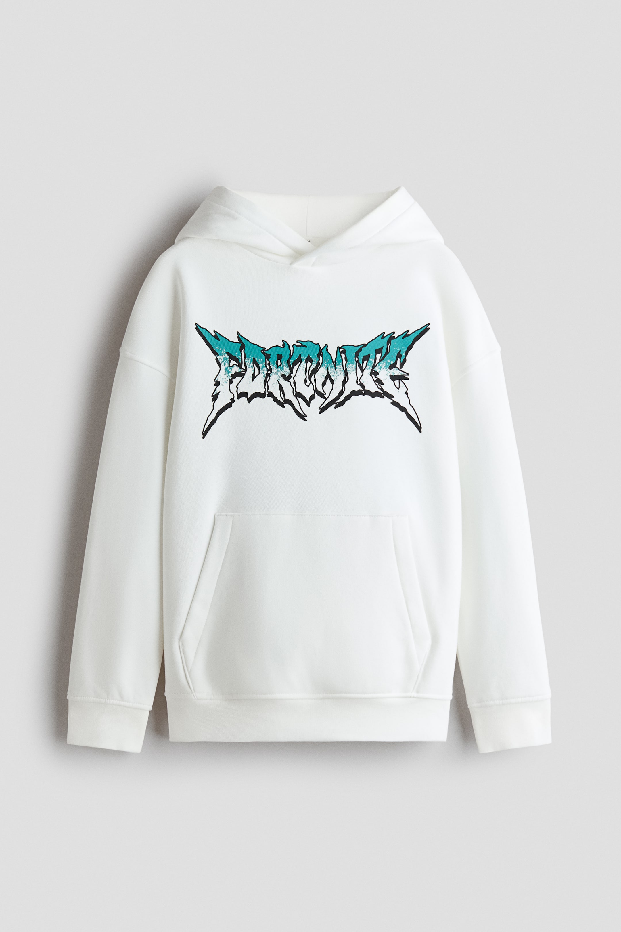 View larger image: A front-facing view of a loose-fit white hoodie featuring a wrap-front lined hood, dropped shoulders, and a kangaroo pocket. The chest features a stylised, jagged "FORTNITE" graphic printed in a teal and white gradient with a black outline.