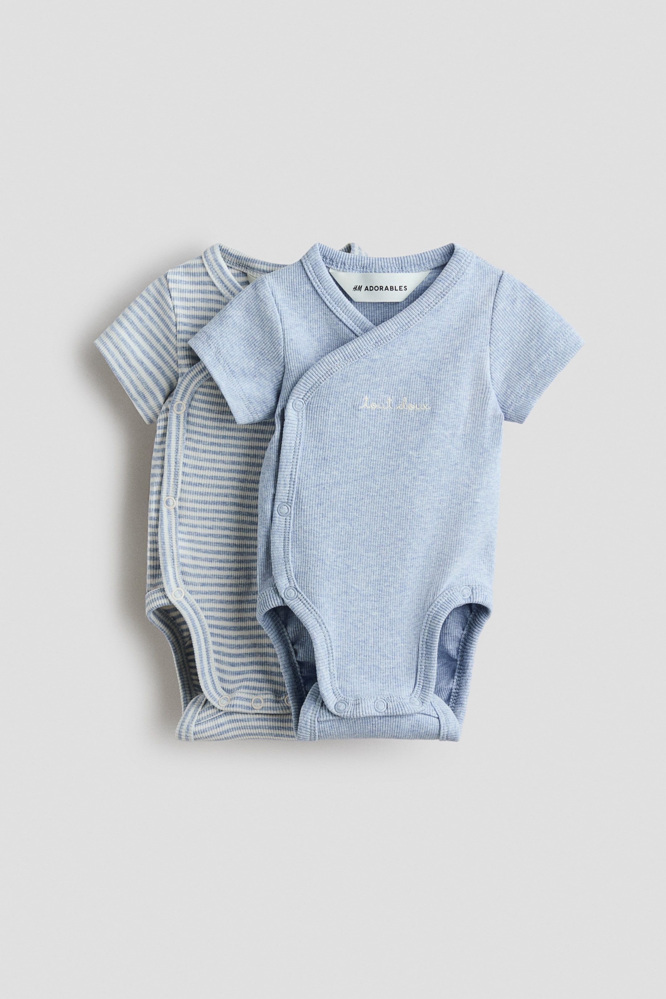 Ver imagem maior: Pack de 2 bodies traçados canelados - Azul claro/Tout doux - CRIANÇA | H&M PT 1