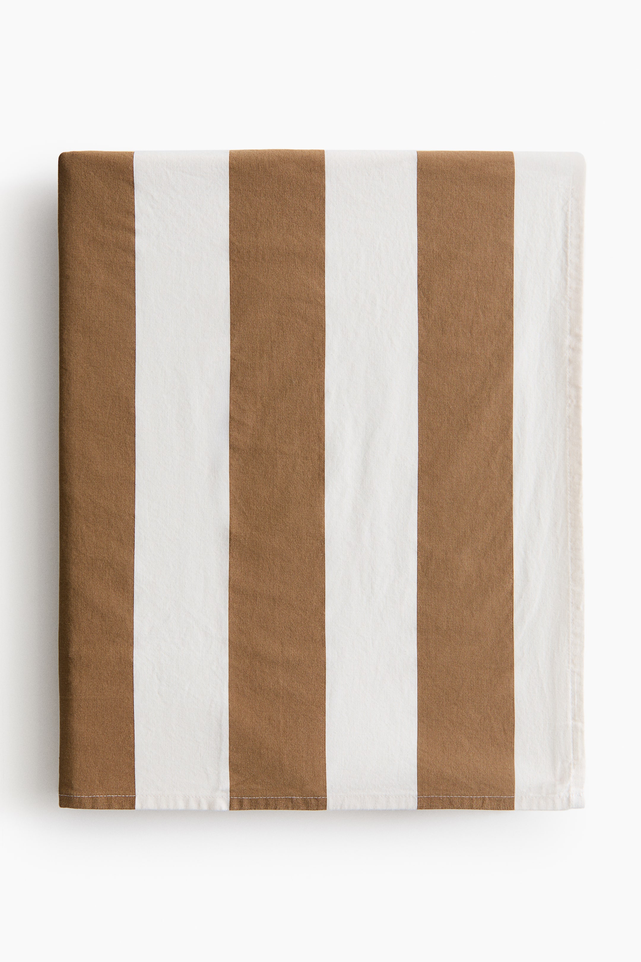View larger image: A fabric is shown in a front view, featuring alternating vertical stripes in brown and white. It is neatly folded, showcasing a visible hemmed edge along the bottom.