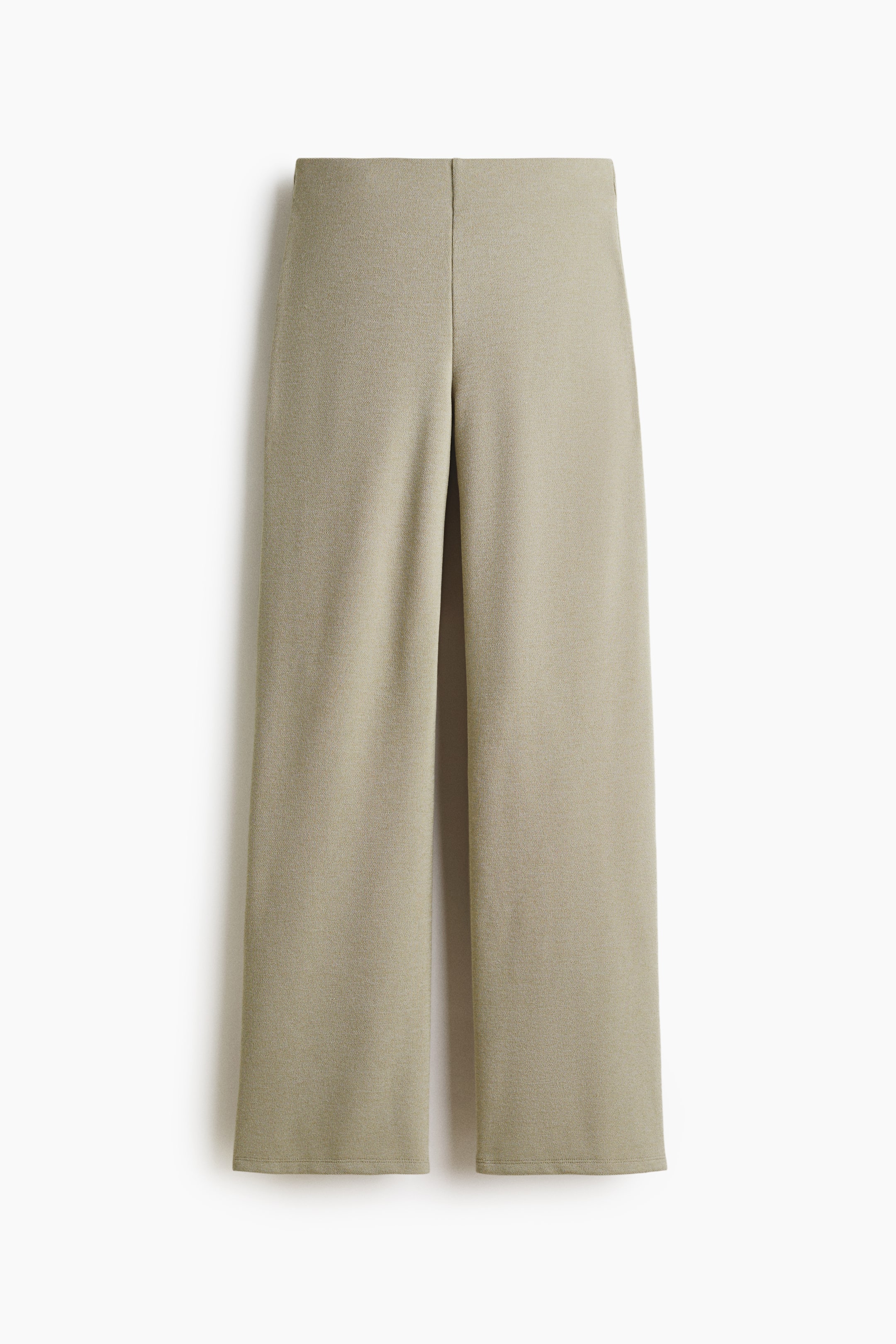 View larger image: "Slim-fit trousers in jersey are showcasing a frontal view, highlighting a high waist with concealed elastication and straight legs. The fabric exhibits a subtle, fine texture."