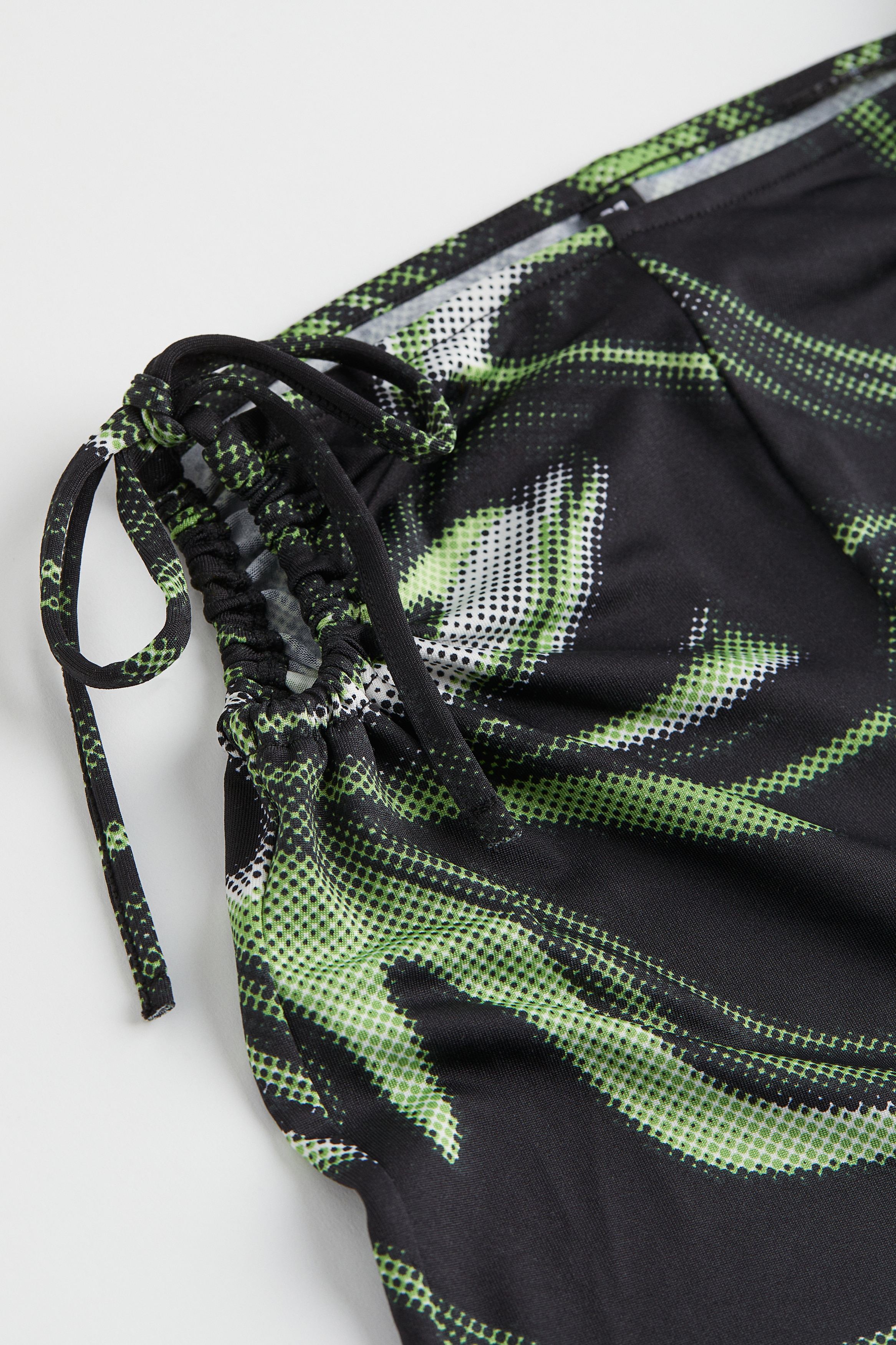 Cut-out-detail patterned trousers
