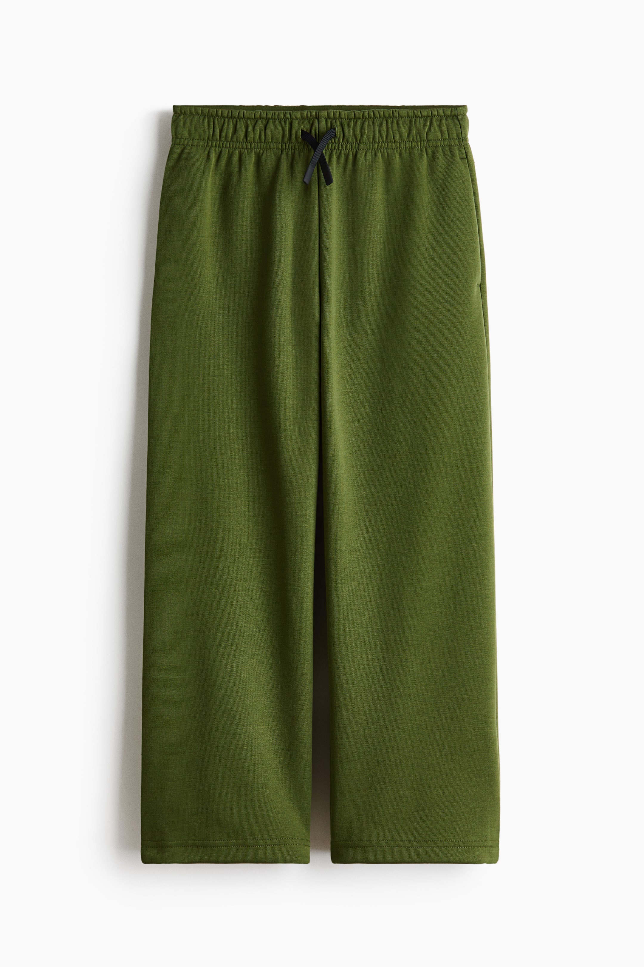 Voir une image plus grande: Pantalons de survêtement en maille chinée vert olive, vue de face. Ils présentent une taille élastiquée avec un cordon noir noué en nœud, et une coupe droite avec un ourlet simple.