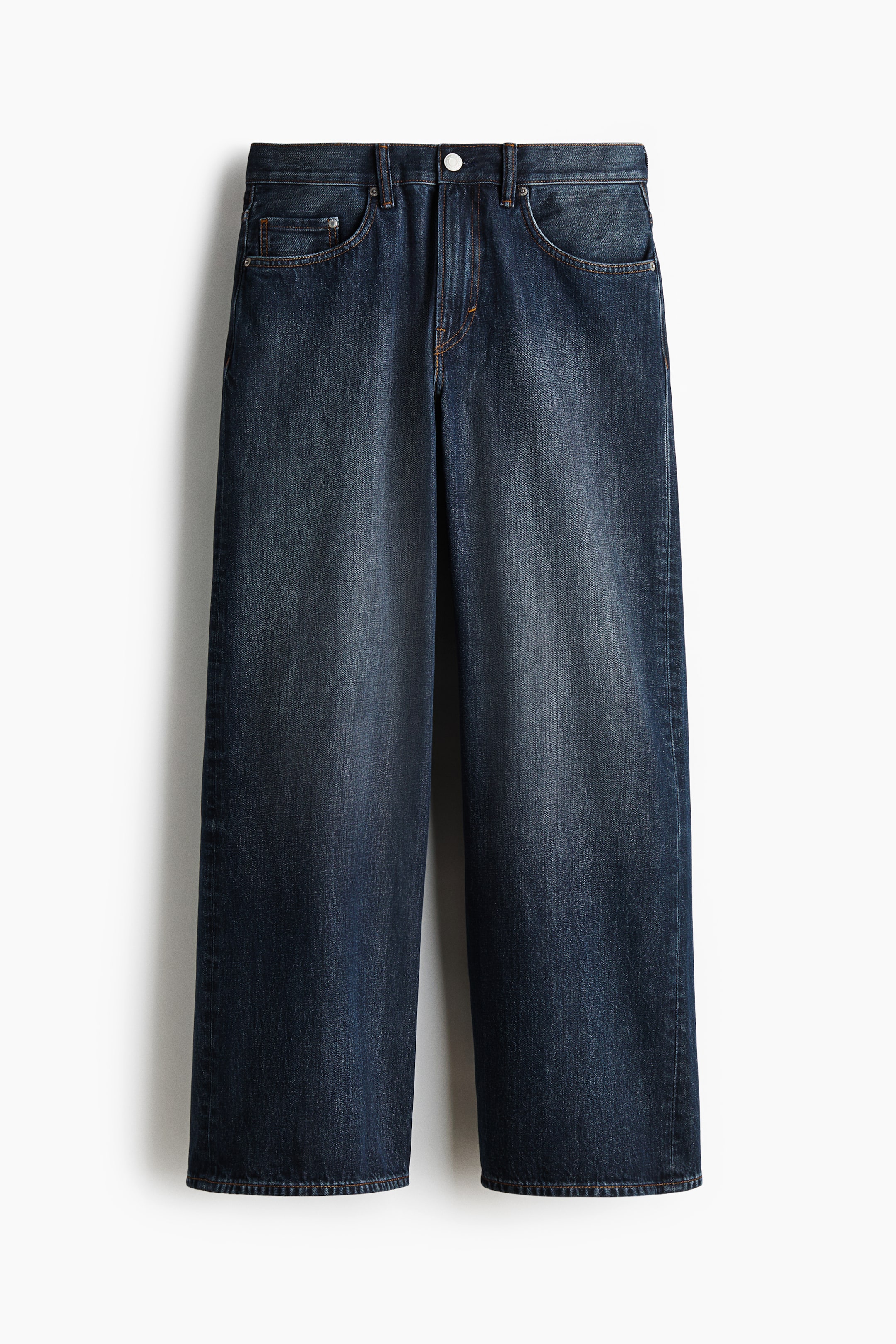 View larger image: These dark blue wide-leg jeans are presenting a front view, featuring lighter fading on the thighs and front. They are designed with a button closure, a zipper fly, two curved front pockets, and a coin pocket.