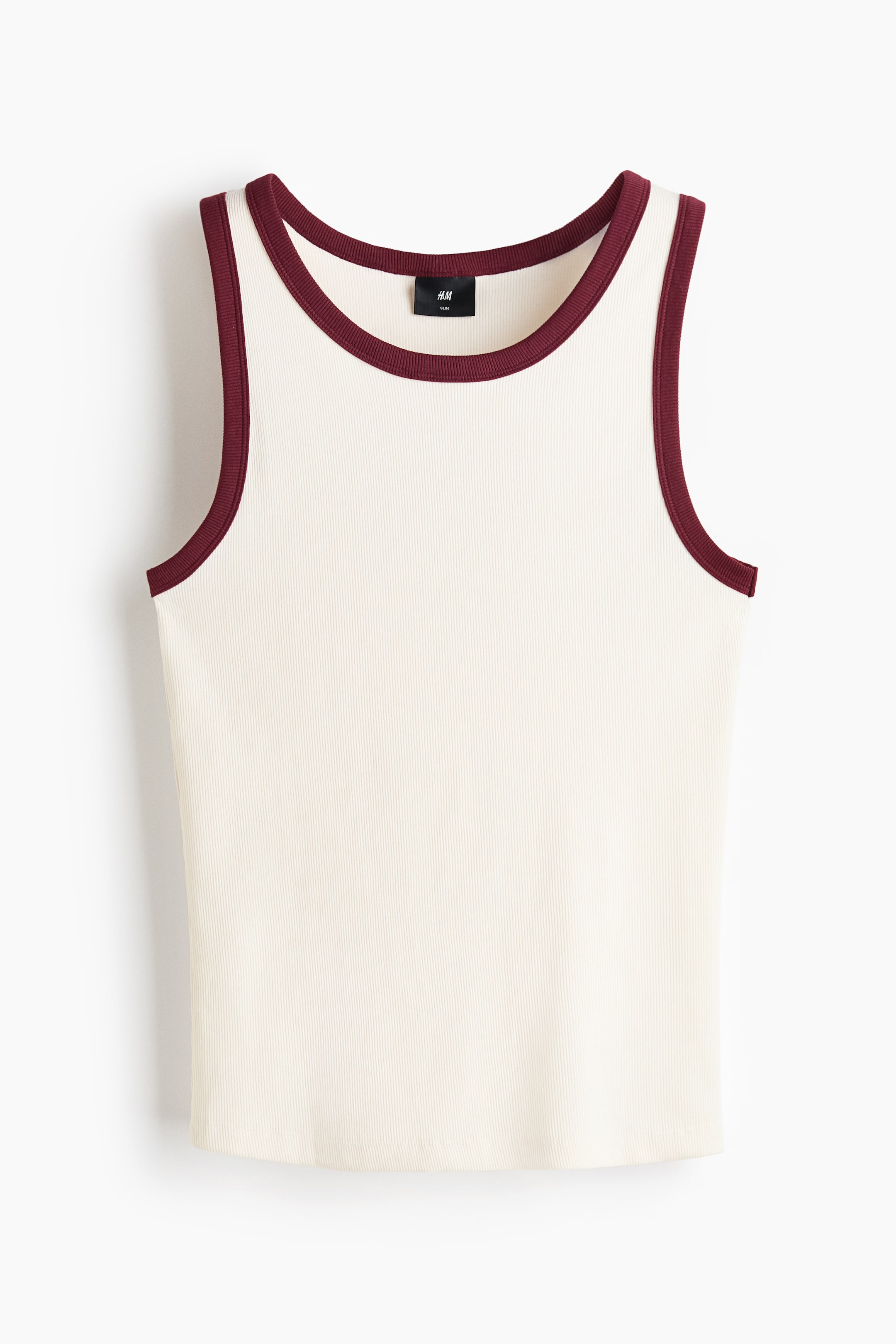 View larger image: The ribbed tank top is displayed front-facing, showcasing an off-white body accented by dark red trim along the round neckline and armholes. A small black brand label is visible at the inner back neck.