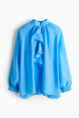 Blus i lyocellmix med volang