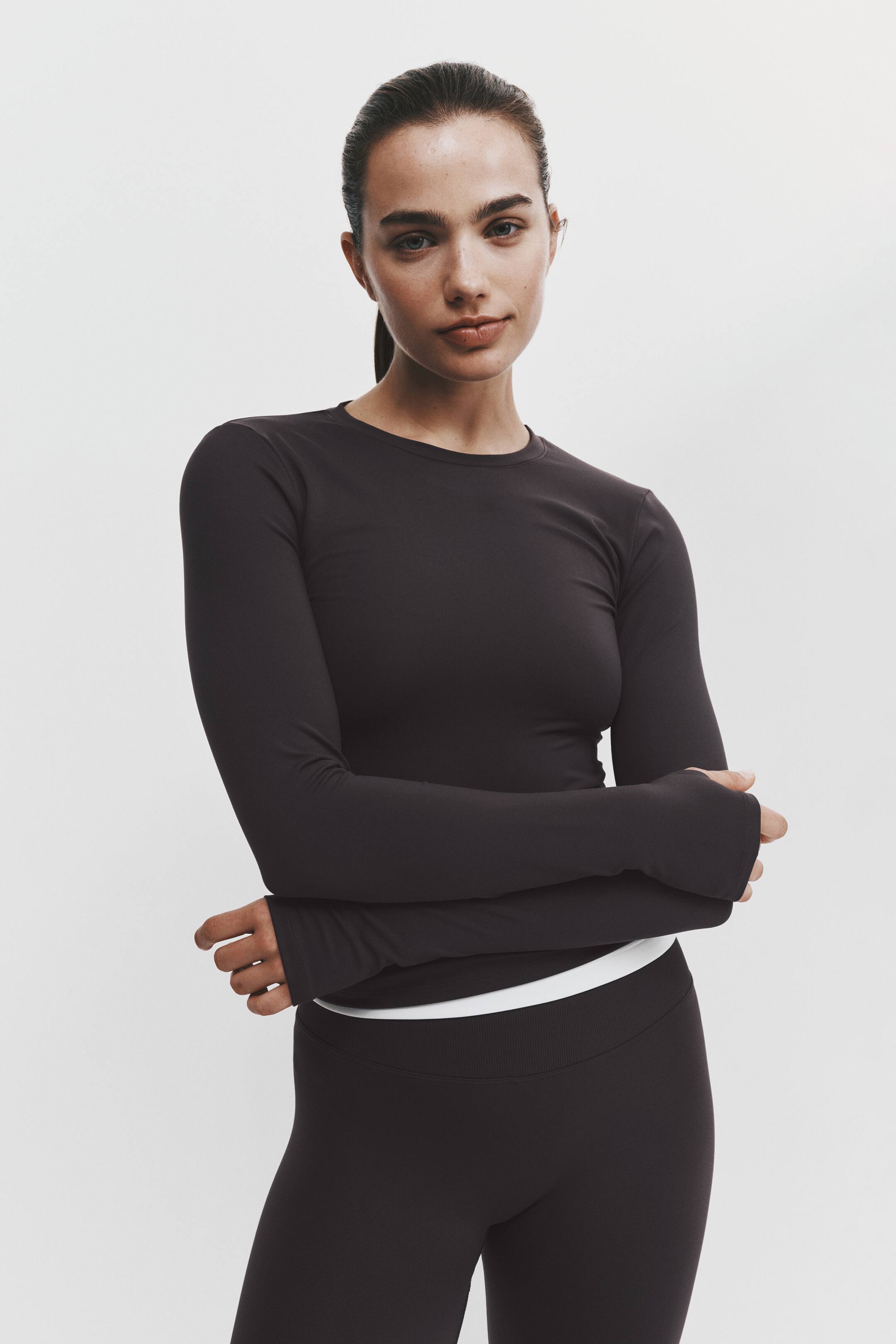 View larger image: Slim Fit Long-sleeved sports top with SoftMove™ - Dark heather - Ladies | H&M 1