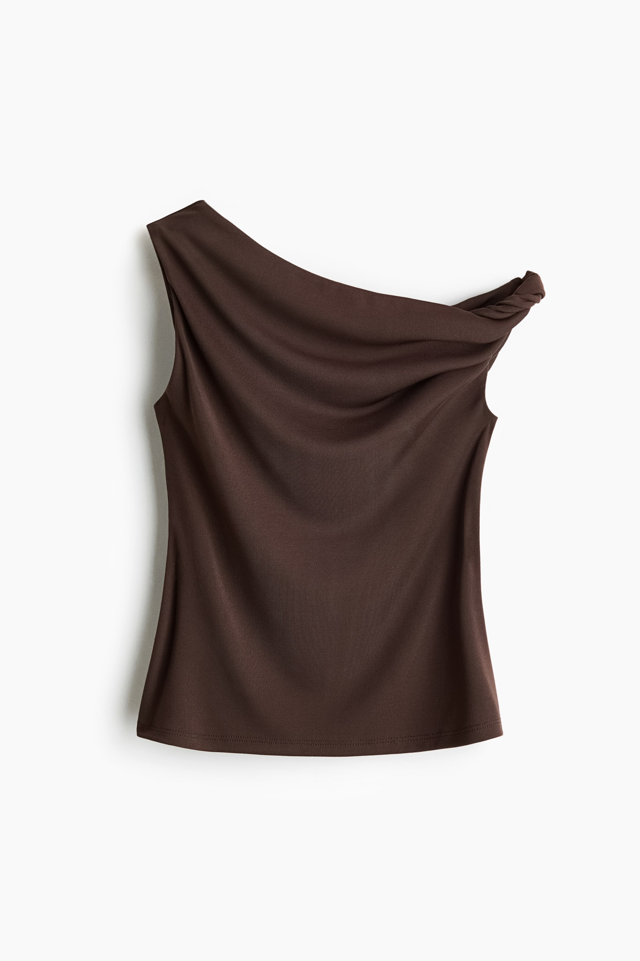 View larger image: The dark brown one-shoulder top is featuring a twisted shoulder strap on the right, with the fabric draping across the front to form a soft cowl neckline.