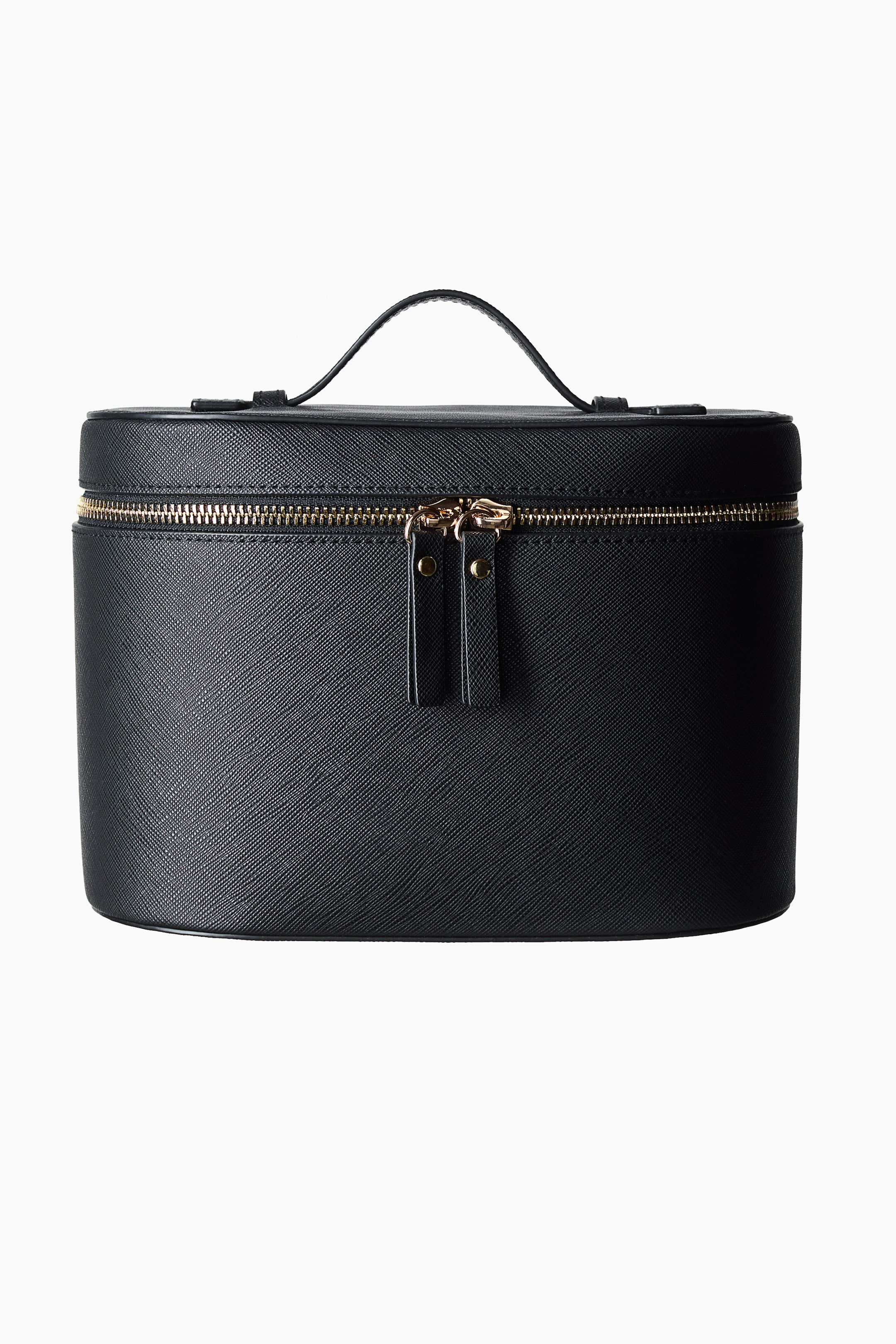View larger image: A black cosmetic case is displayed from the front, showcasing a textured finish. A gold-toned zip runs along the top edge with two black leather zip pulls, and a single top handle arches over the lid.