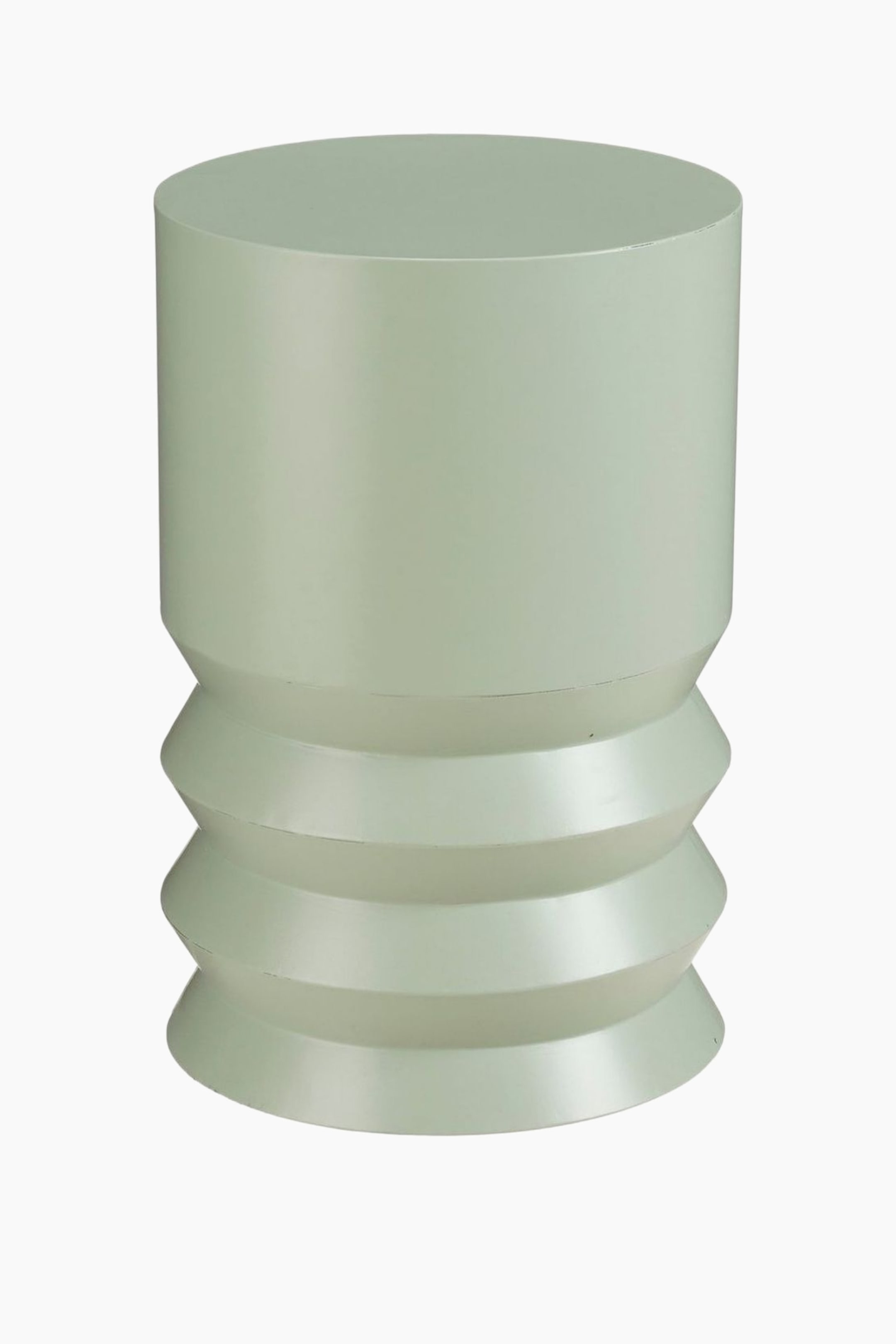 Se større billede: Et lysegrønt cylindrisk objekt viser en glat øvre sektion og tre lagdelte, udadgående segmenter i den nederste del, der vender fremad.