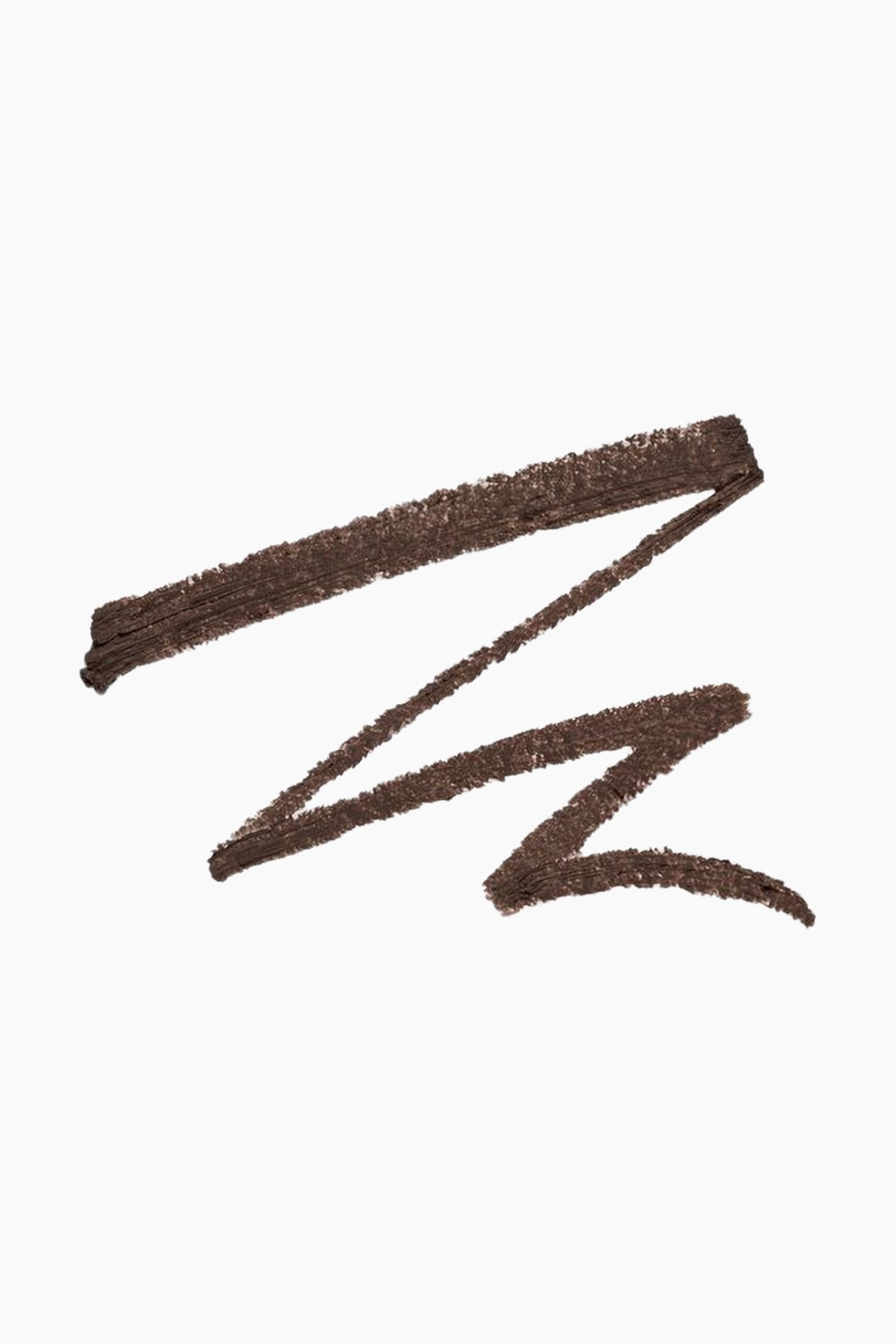 Näytä suurempi kuva: Tummanruskea meikkituote on swatchattu muodostaen teksturoidun, siksak-kuvion.