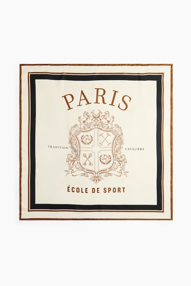 A square scarf in a soft weave is displaying a front view, featuring an off-white center with a brown printed heraldic crest, the arched text "PARIS" above, and "ï¿½COLE DE SPORT" below. The design is framed by a thick black inner border and a thin brown outer edge. - 1