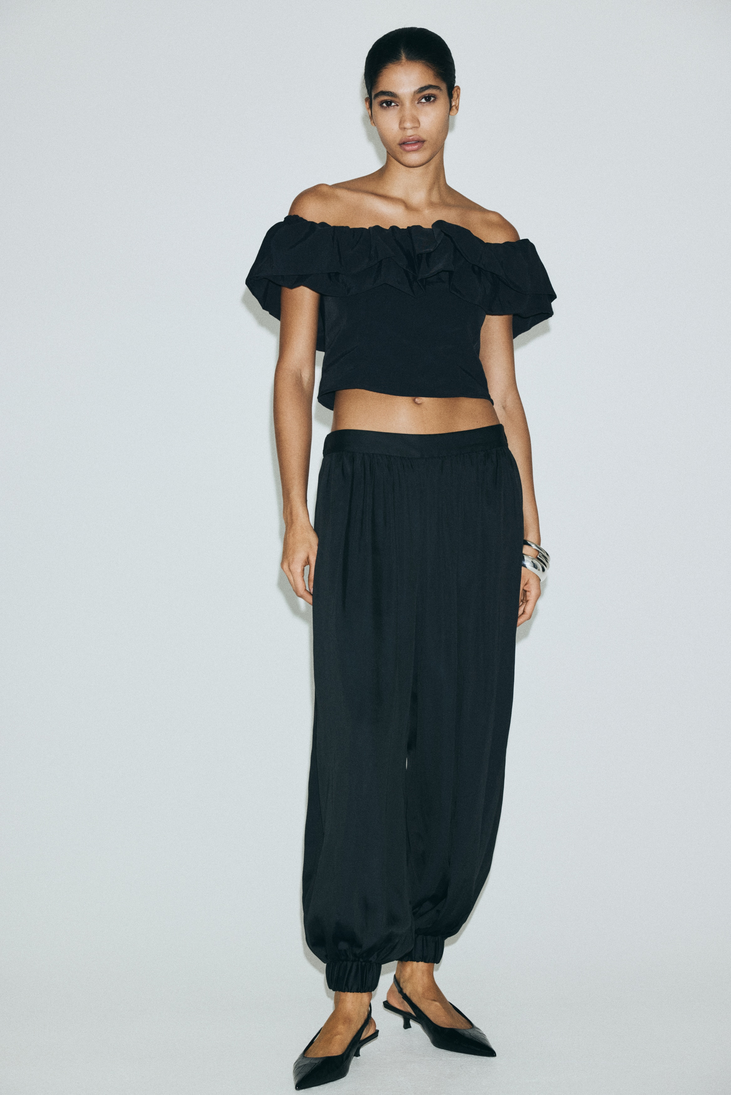 Frill-trimmed off-the-shoulder top