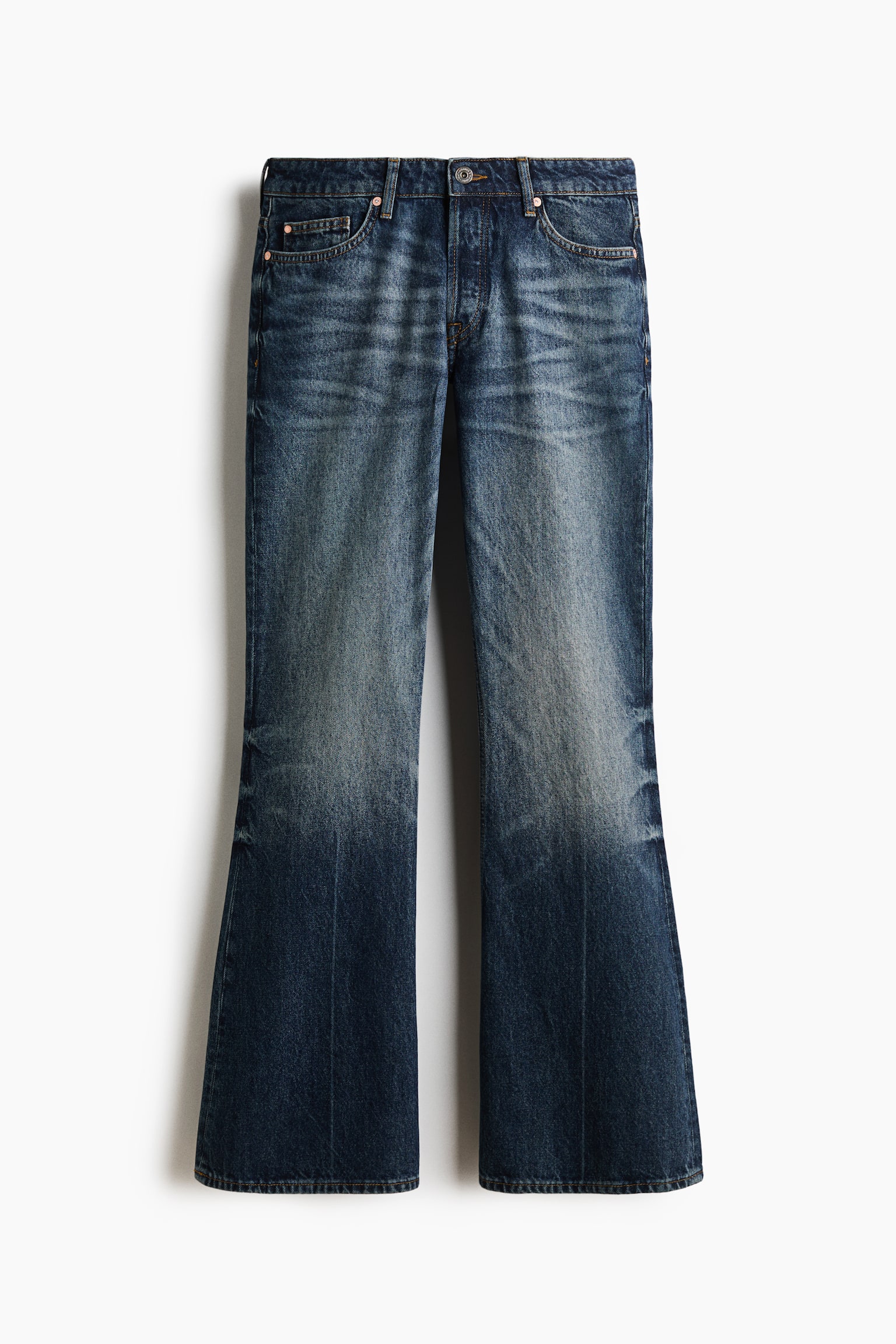 These dark blue denim jeans are shown front-facing, featuring a five-pocket design with a regular waist, belt loops, and a button fly. The jeans have a faded wash with whiskering across the thighs and flare from the knees down to the hems. - 1