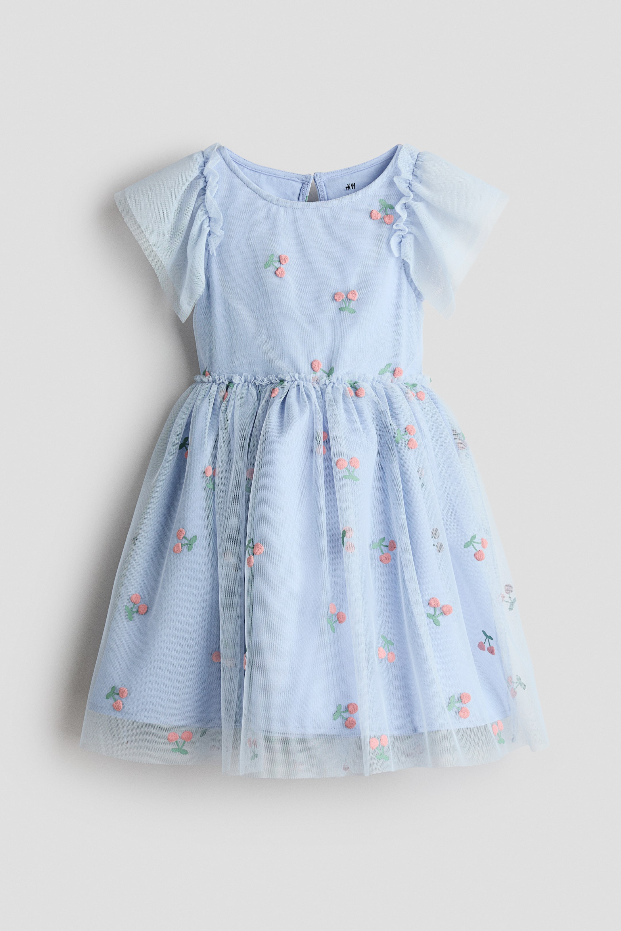 View larger image: A light blue frock is showcasing its front, featuring a round neckline and short ruffled cap sleeves crafted from sheer tulle. Embroidered pink and green cherry motifs embellish both the light blue bodice and the full skirt, designed with a gathered waistline and a sheer tulle overlay.