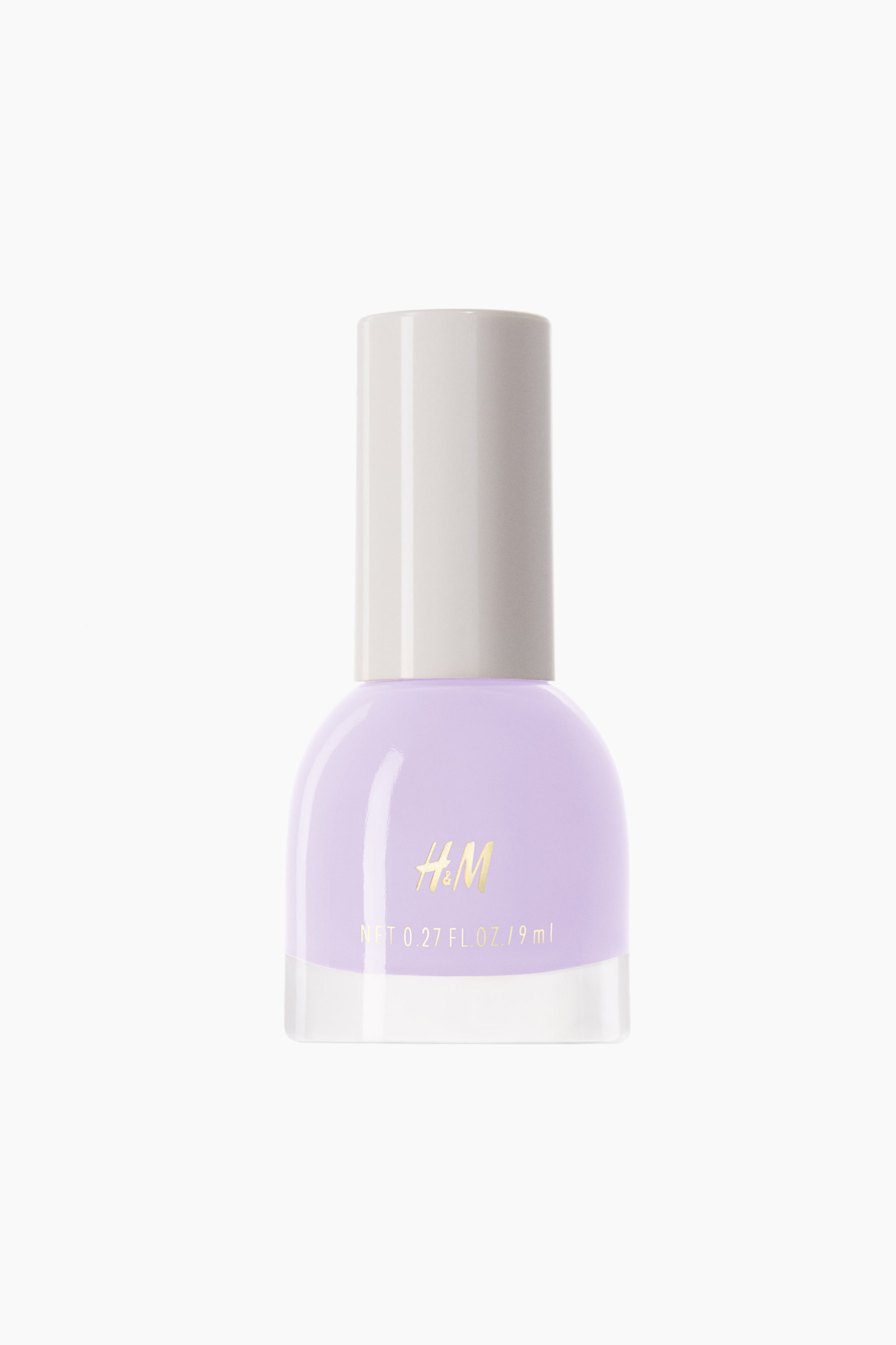 View larger image: A light purple nail polish bottle is showcasing its front, with a transparent base and a light grey cylindrical cap. The gold "H&M" logo and volume measurement are clearly visible on the bottle's front.