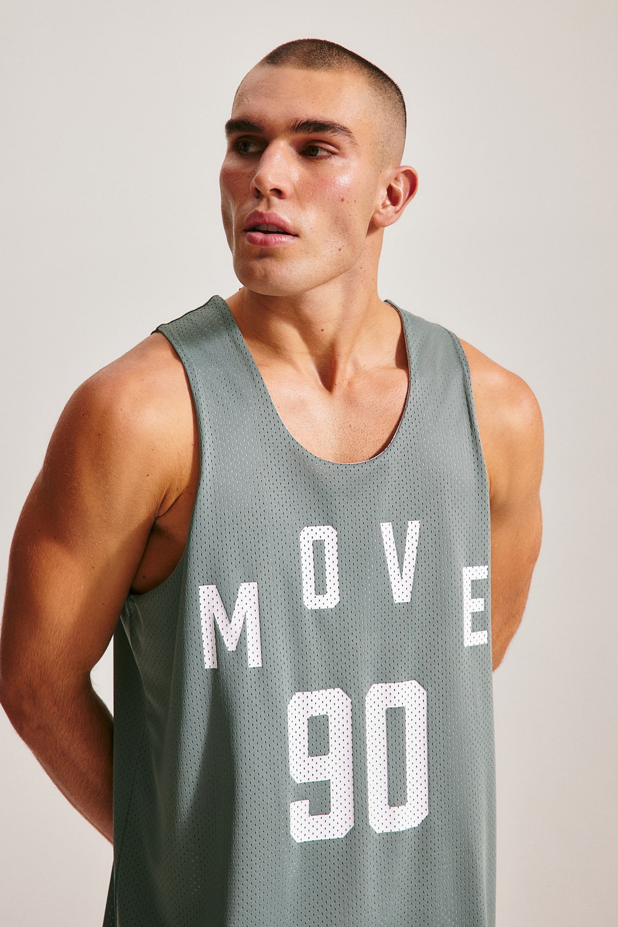 Loose Fit Basketball Shirt in DryMove™ - Light khaki green - Men | H&M CA