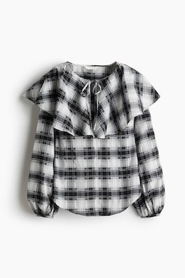 Blus med capedetalj