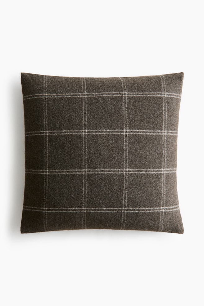 A rectangular cushion featuring a dark charcoal plaid pattern with thin light grey and off-white windowpane lines. The fabric appears with a slightly textured finish. - 1