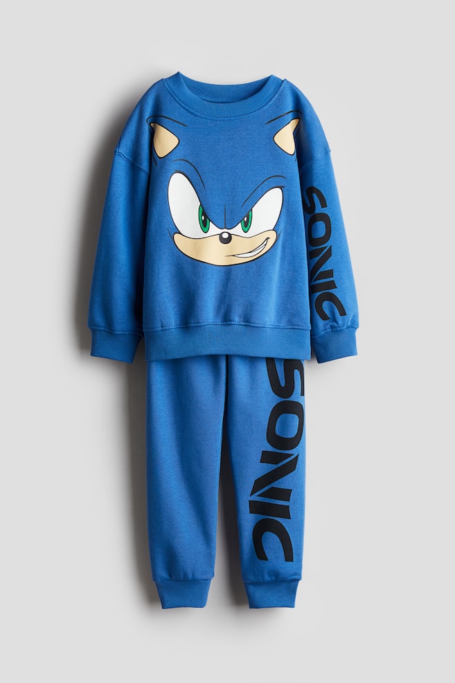 Ensemble 2 pièces en molleton imprimé - Bleu vif/Sonic le Hérisson/Gris clair chiné/Among Us/Beige/Marvel Comics/Vert kaki/Jurassic World/Turquoise/Minions/Bleu ancien foncé/Cars/Noir/Minecraft/Gris/Marvel Comics/Beige clair/Marvel Comics - 1