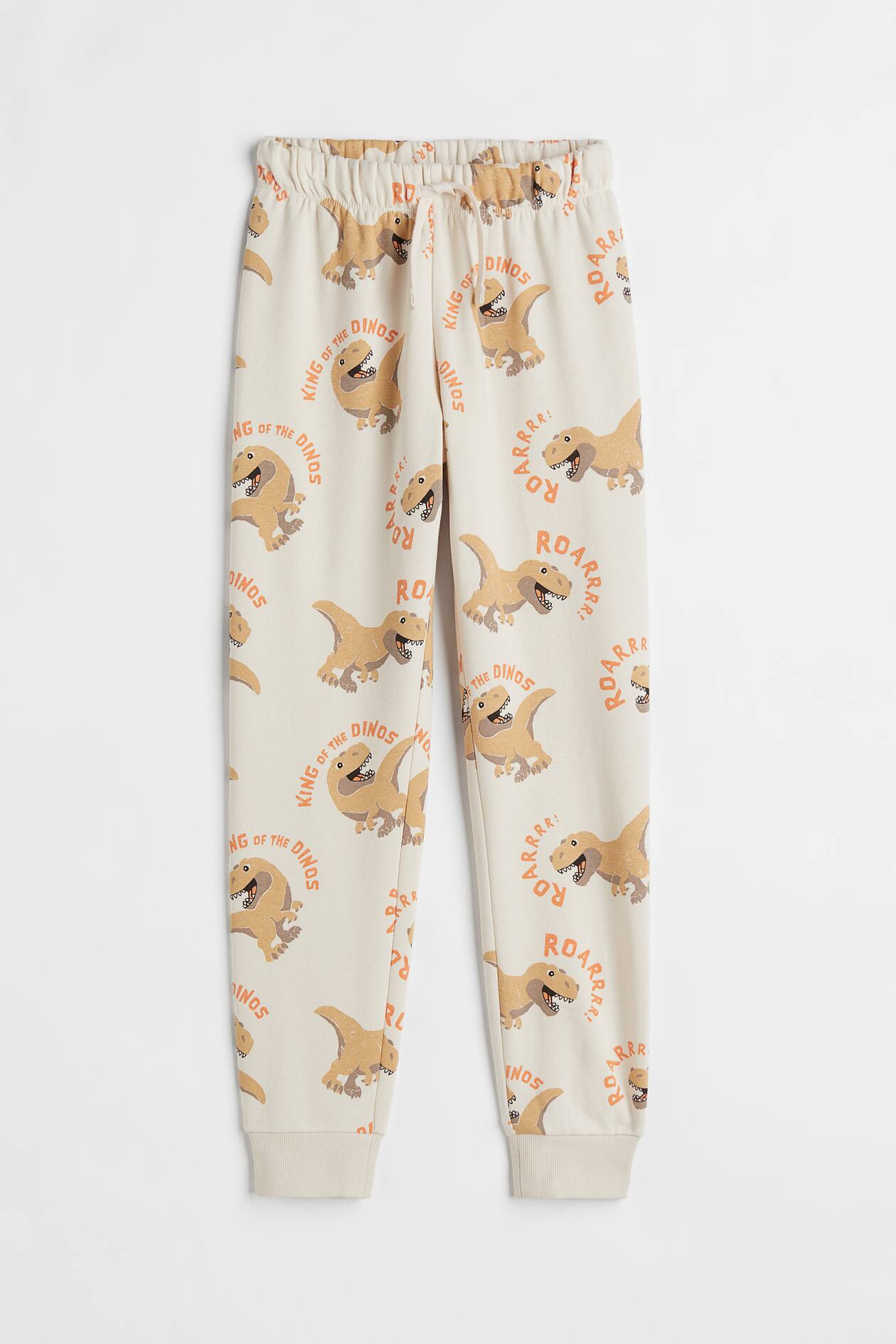 Sweatpants - Regular waist - Long - Light beige/dinosaur - Kids | H&M US