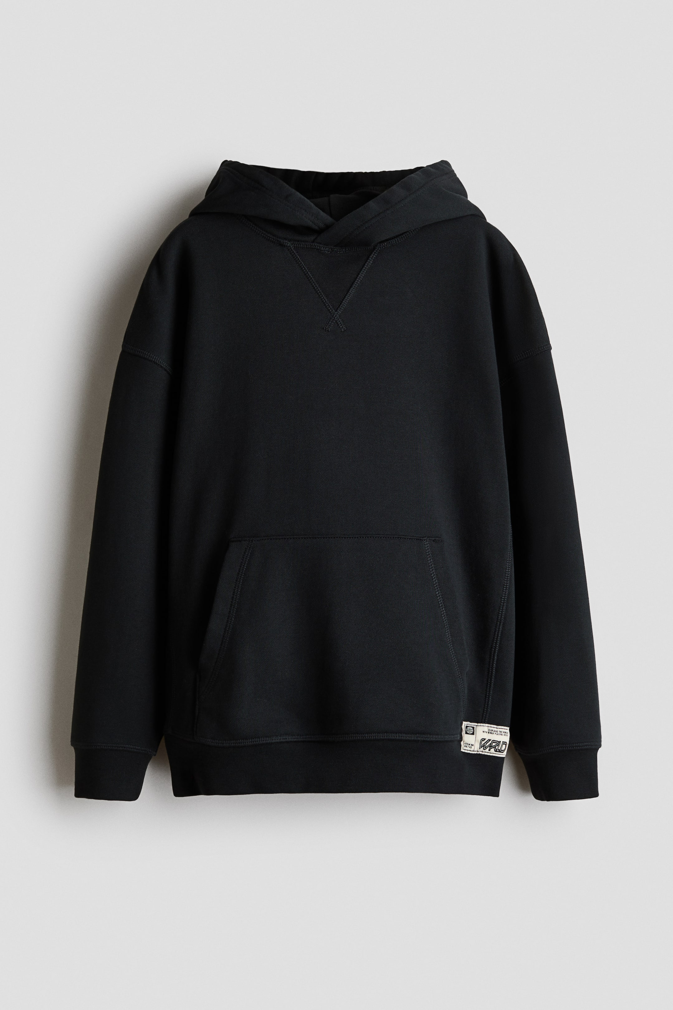 View larger image: A black hoodie is facing front, featuring a crossover hood, drop shoulders, and a decorative V-stitch detail at the neck. It is displaying long sleeves with ribbed cuffs, a front kangaroo pocket, and a ribbed hem accented with a small woven tag on the lower right side.