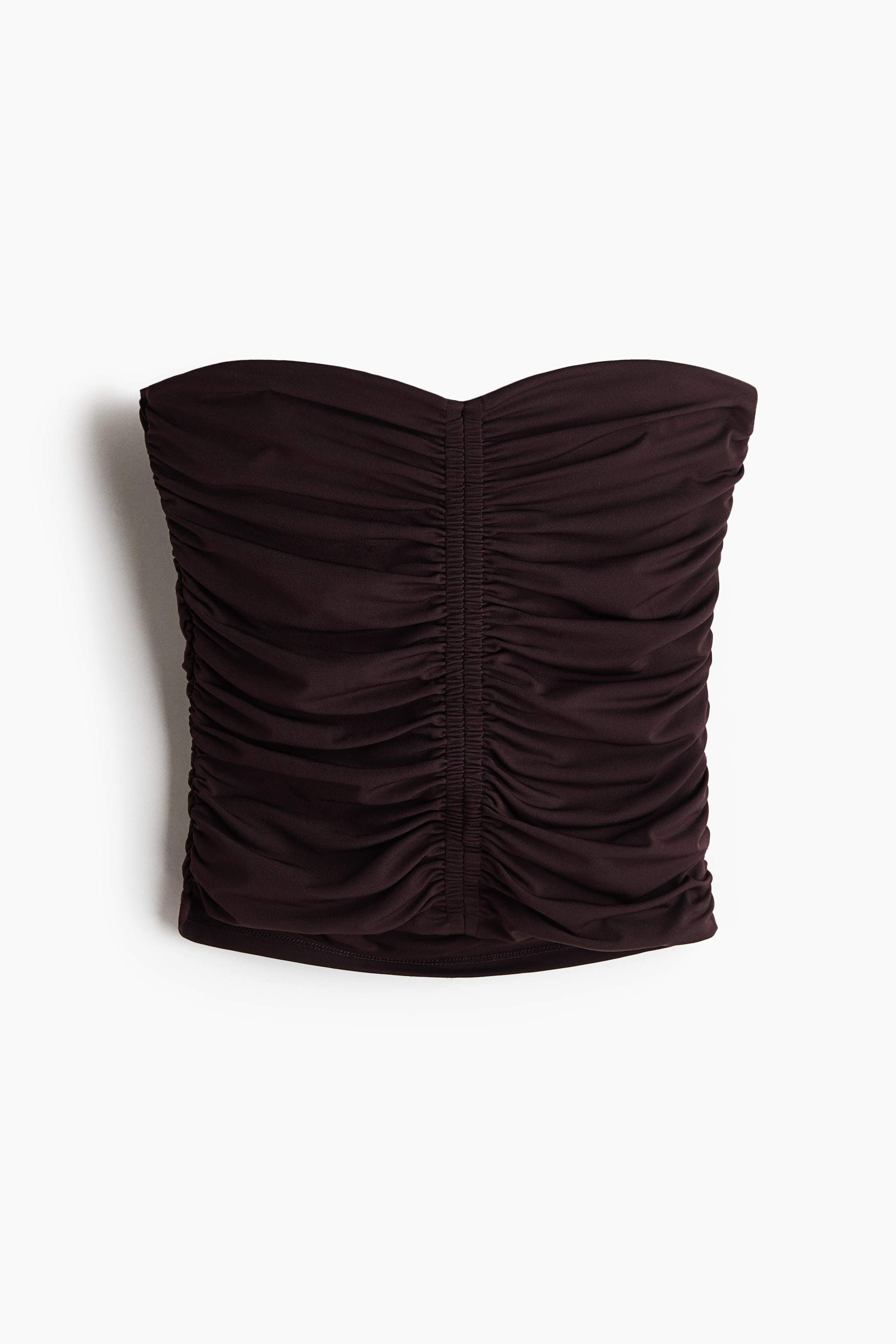 View larger image: A fitted, dark brown bandeau top featuring a sweetheart neckline, with extensive ruching creating a draped effect down the front and sides.