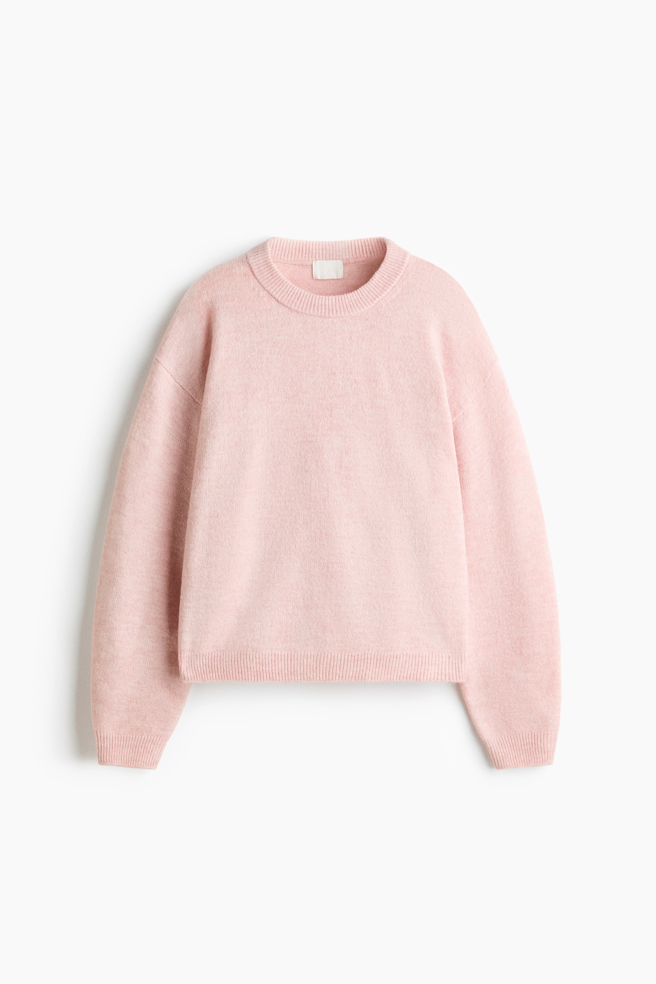 View larger image: A light pink crewneck sweater is facing front, showcasing a soft knit texture and a relaxed fit with dropped shoulders. The sweater features a ribbed crew neckline, ribbed cuffs on the long sleeves, and a ribbed hem.