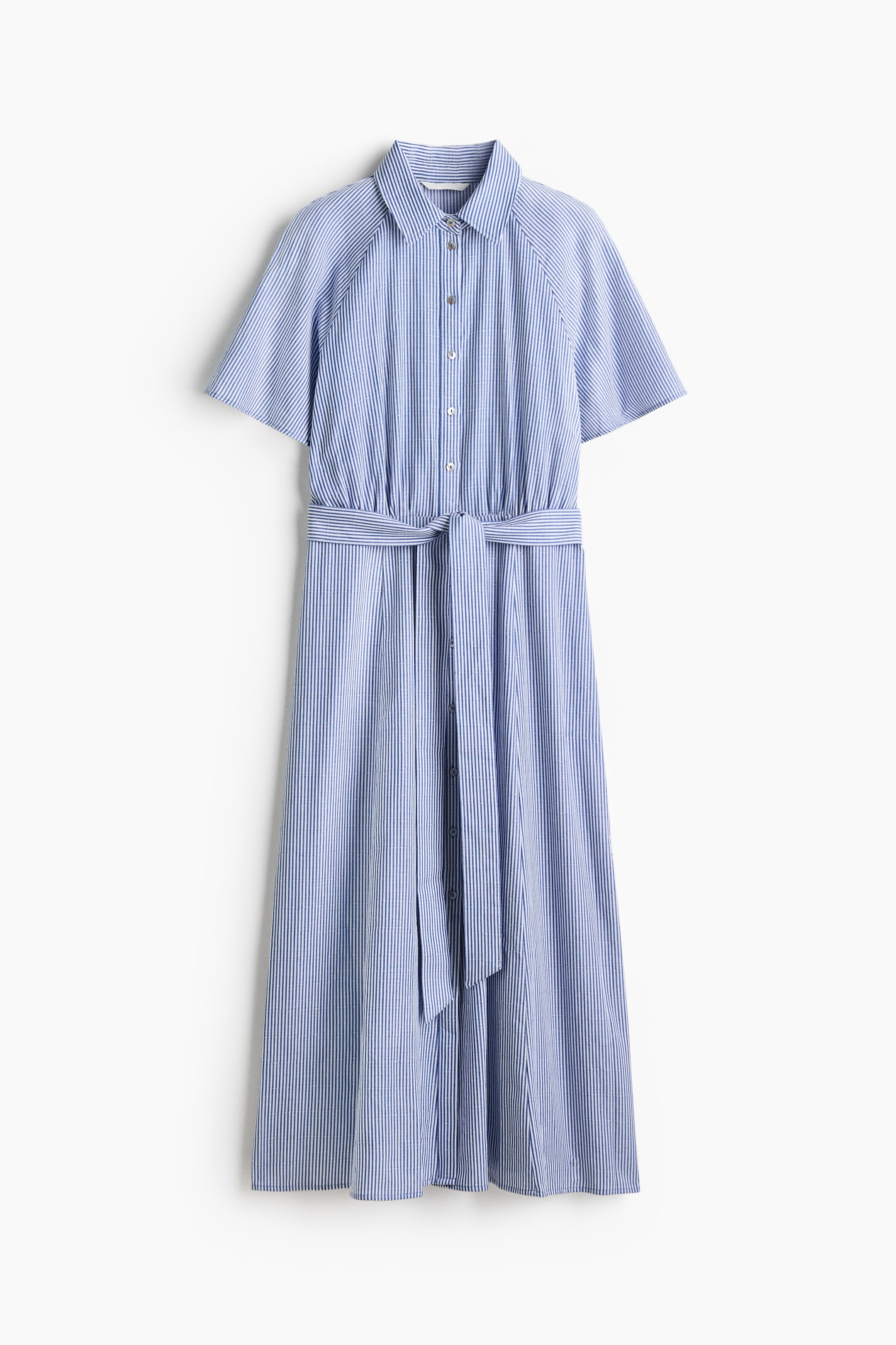 View larger image: The blue and white striped shirt dress showcases its FRONT with a classic collar, a button-down placket, and short raglan sleeves. The gathered waist is cinched by a self-tie fabric belt, flowing into a midi skirt.