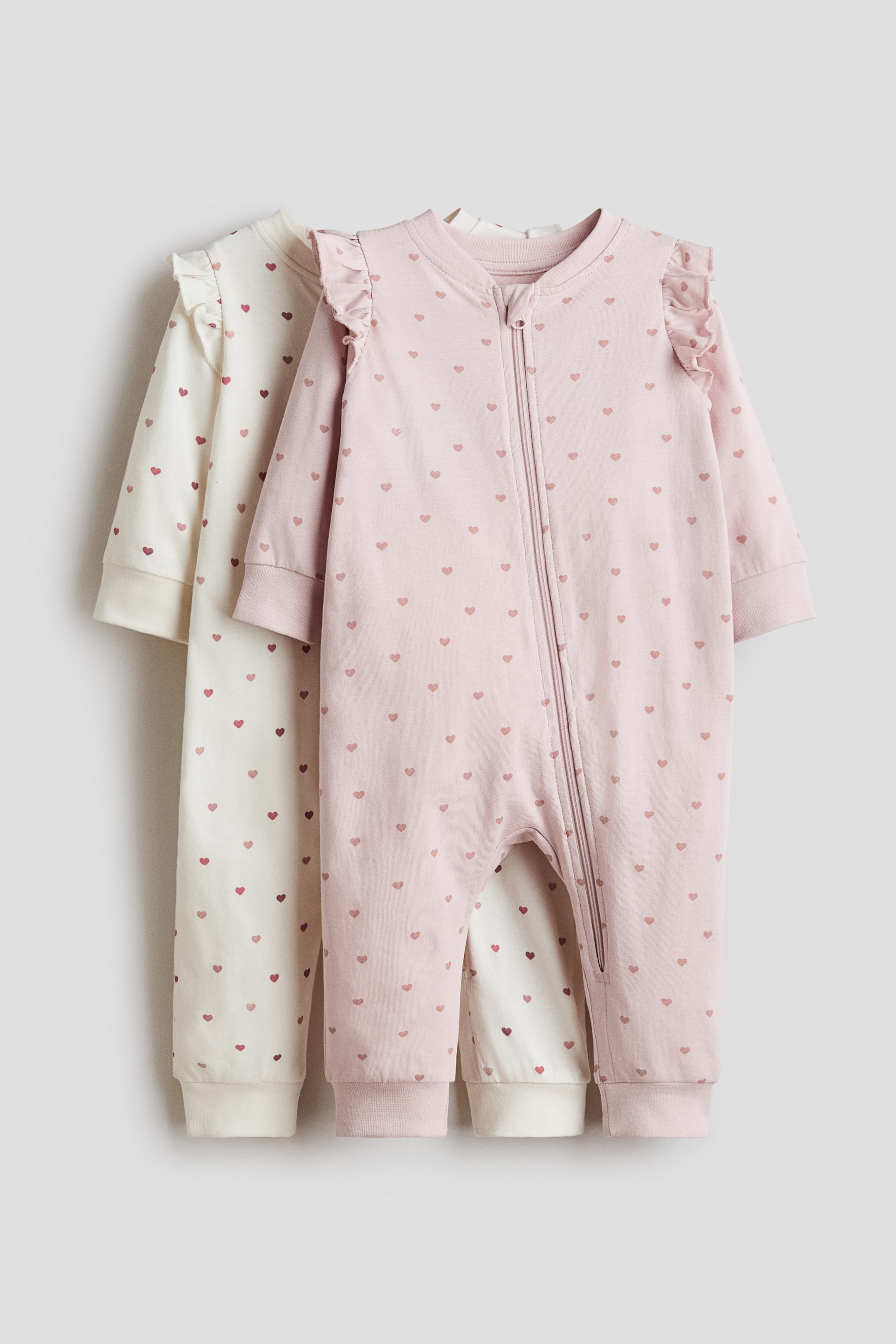 Größeres Bild anzeigen: 2er-Pack Baumwoll-Schlafanzüge mit Reißverschluss - Hellrosa/Herzen - Kids | H&M AT 1