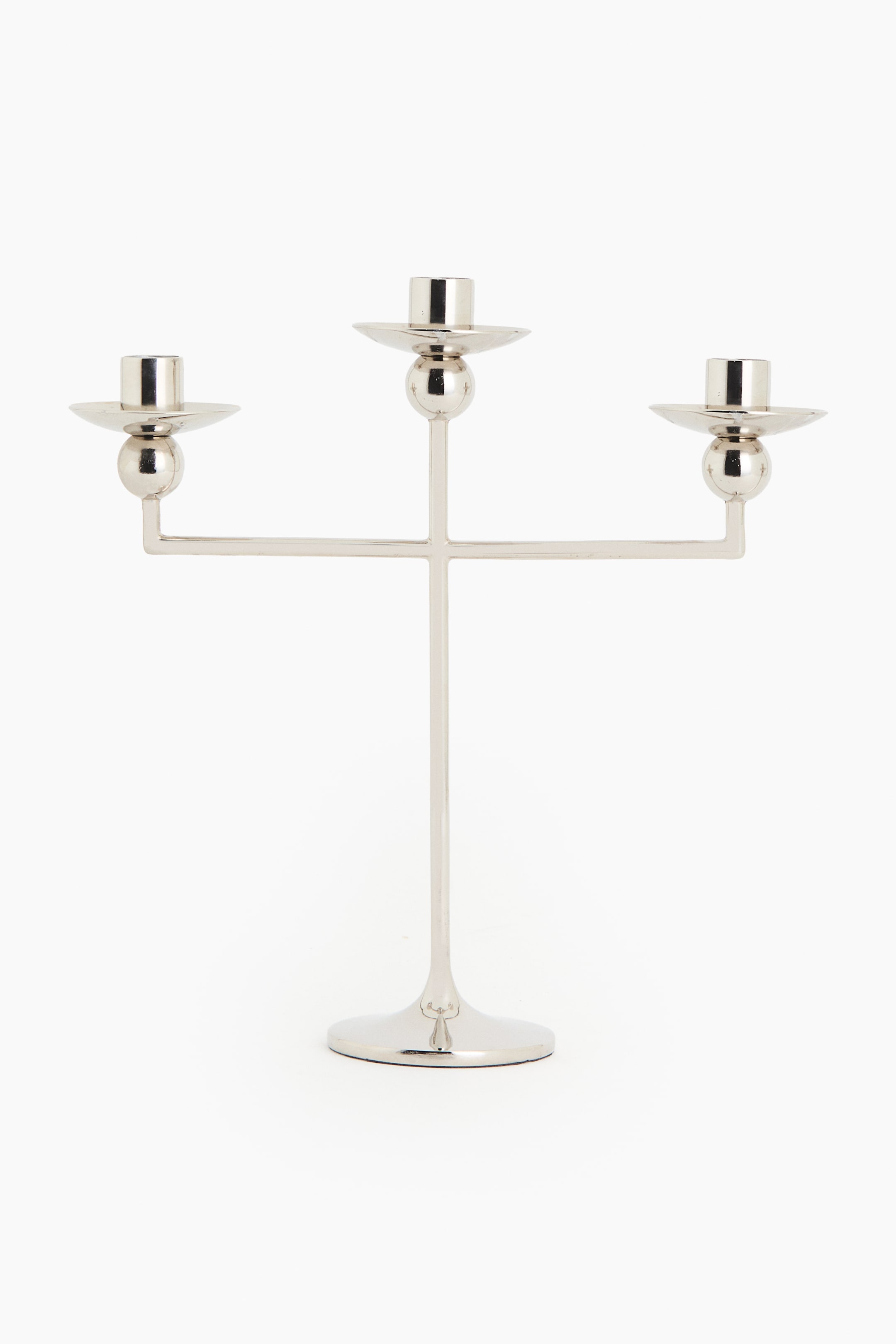 View larger image: A three-armed candelabra in polished stainless steel showcases a sleek design, featuring spherical details beneath each of its three candle holders.