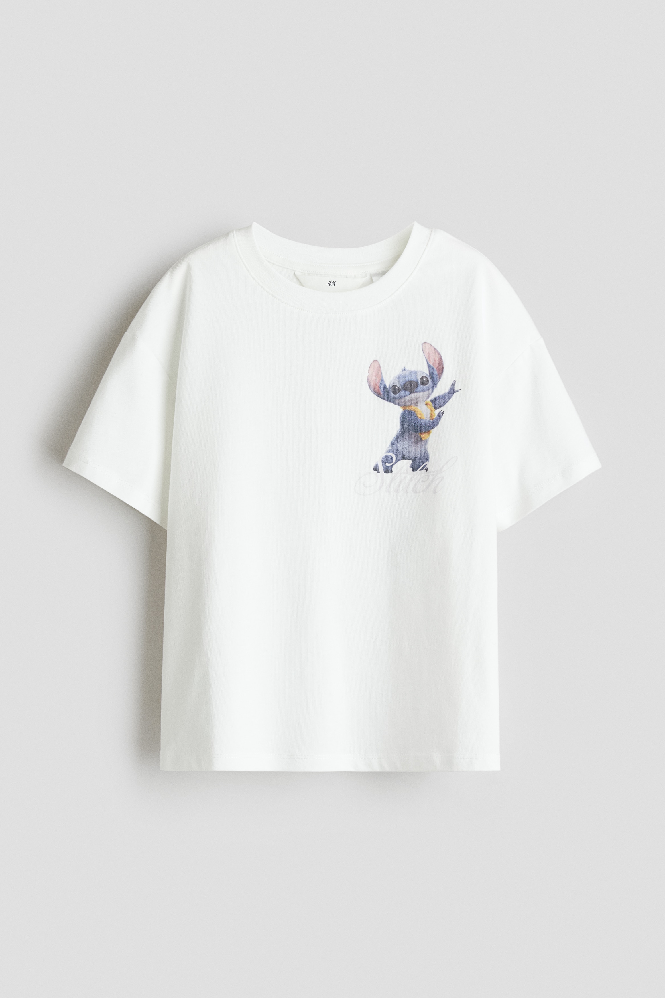 Printed cotton T-shirt - White/Lilo & Stitch/Light pink/Miffy/Light grey/Lilo & Stitch/Light yellow/SmileyWorld®/Pink/Badtz-Maru/Grey/KPop Demon Hunters/White/Garfield/Purple/SmileyWorld®/Dark beige/SmileyWorld®/White/Mickey Mouse/Light pink/Mickey Mouse/White/Hello Kitty/White/My Melody/White/Hello Kitty