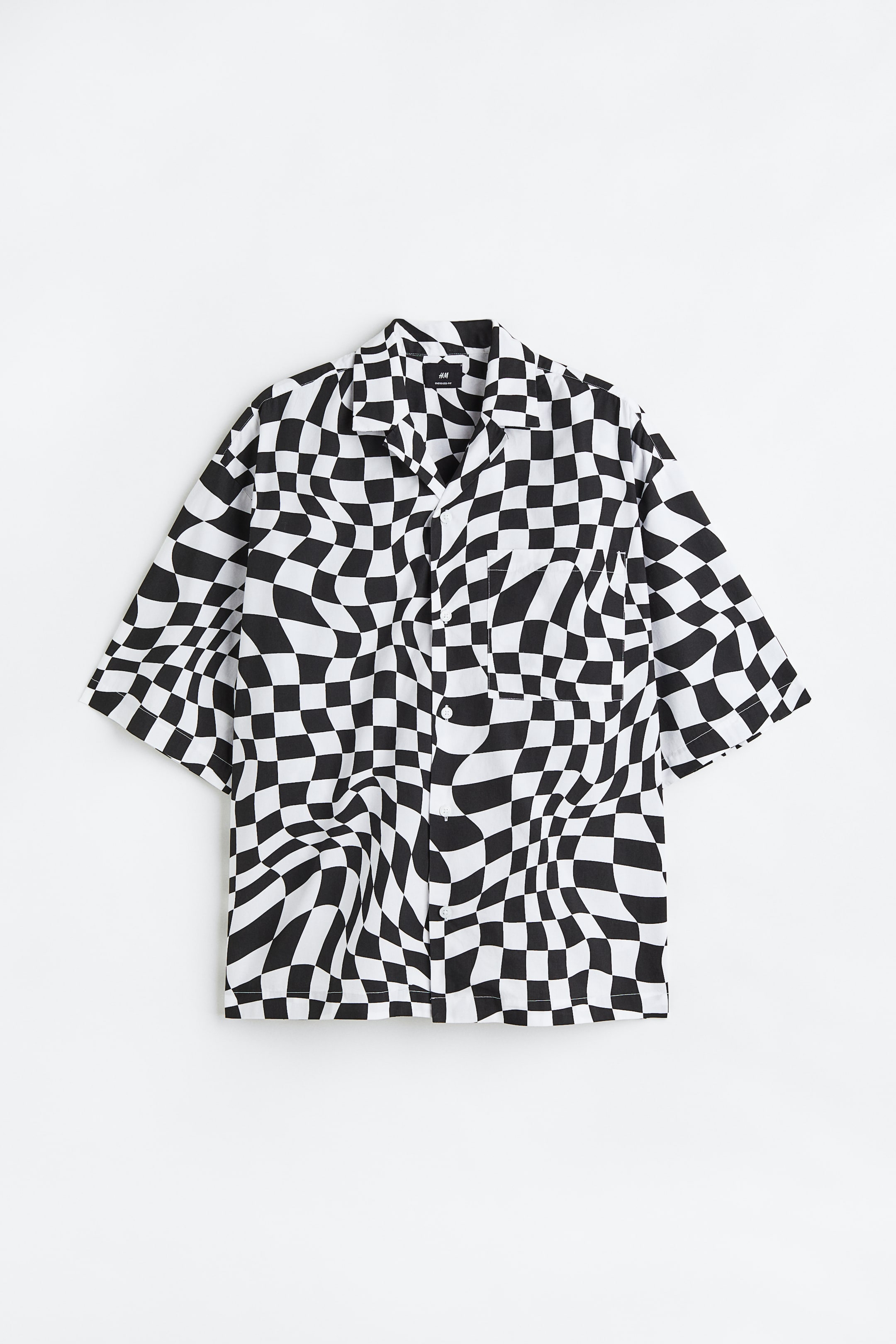 Xem ảnh lớn hơn: Áo sơ mi cổ hai ve hoa văn Oversized Fit - Kẻ ca rô đen/trắng - Men | H&M VN 1