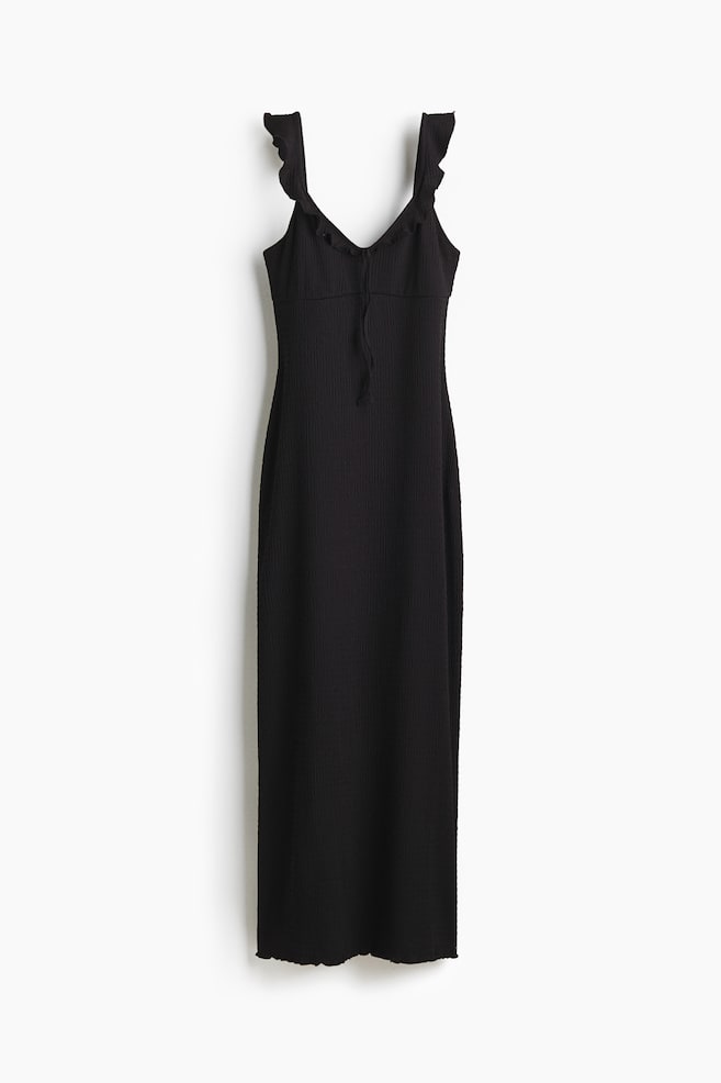 A black ribbed midi dress is presenting from the front, featuring ruffled shoulder straps, a V-neckline with a drawstring detail at the bust, and a wavy hemline. - 1