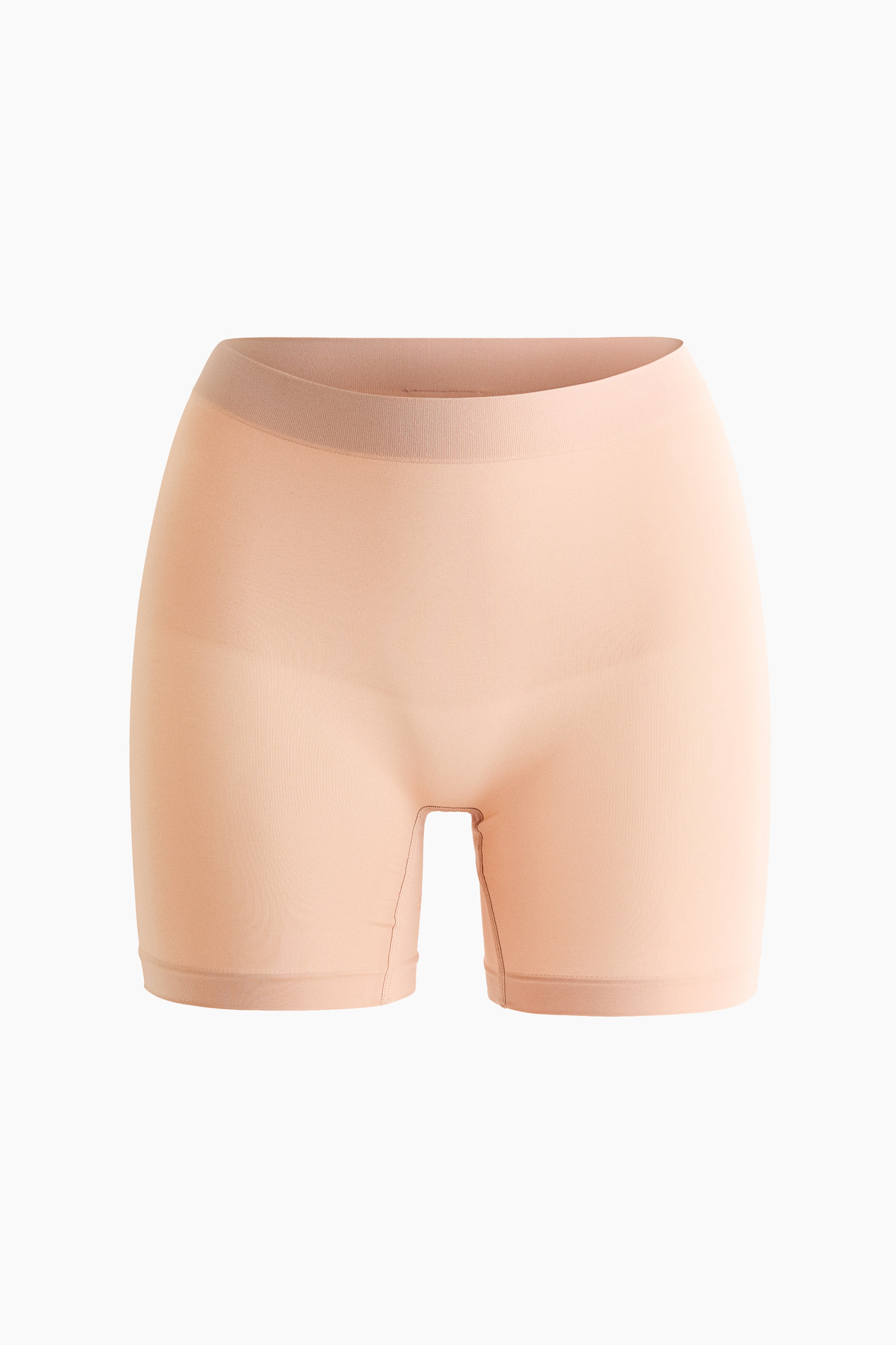 Agrandir l'image: Les cyclistes taille haute couleur pêche clair sont présentés de face. Ils se distinguent par un design sans couture avec une ceinture subtilement côtelée, offrant une apparence ajustée et se terminant à mi-cuisse.
