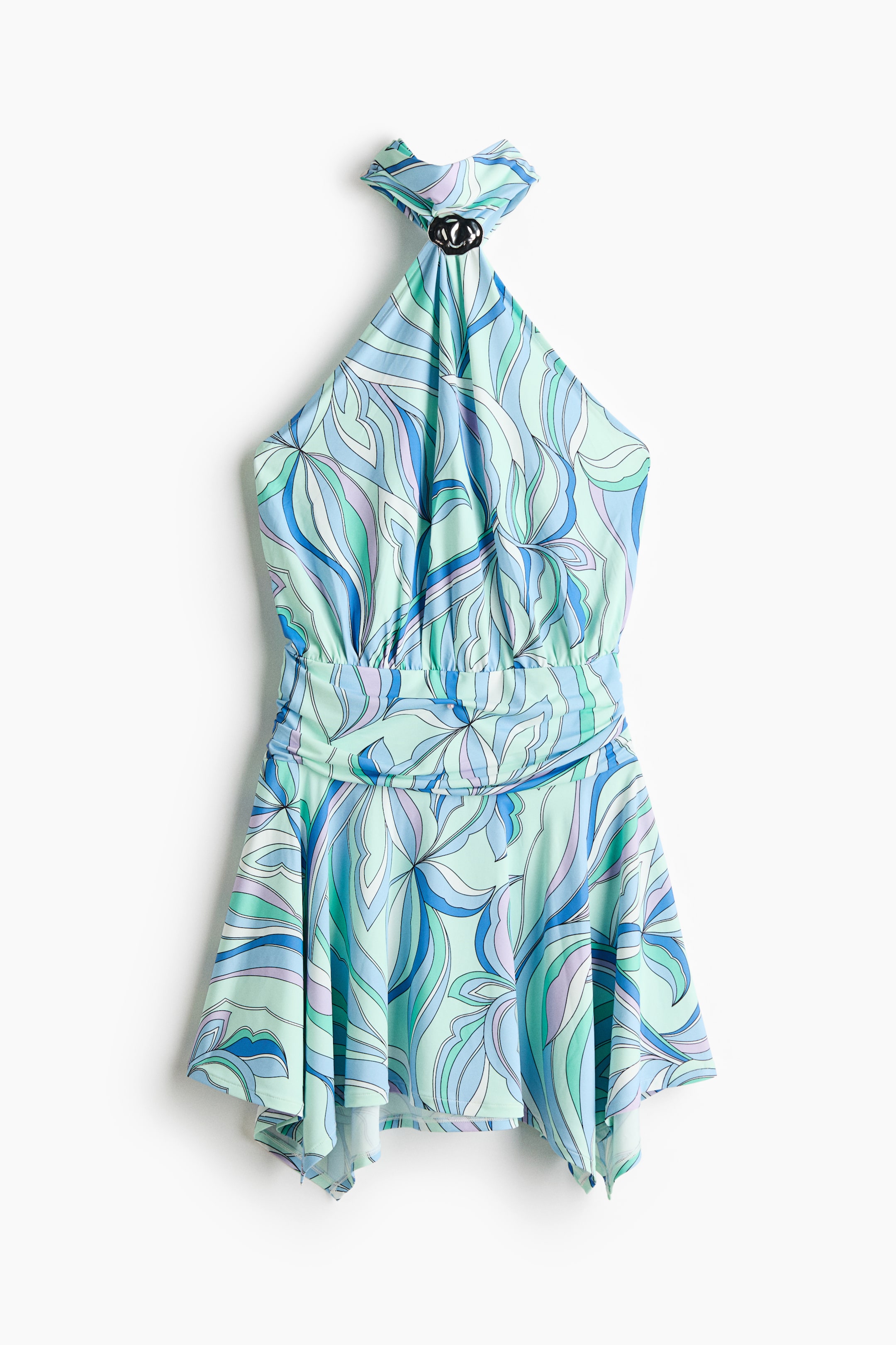 Ver imagen más grande: Un vestido mini de jersey elástico muestra su parte delantera, con un patrón abstracto de remolinos en azul, verde y morado. Presenta un corte extra estrecho en la parte superior con un detalle de metal martillado, un cuello alto con tiras anchas tipo halter, una cintura fruncida y una falda acampanada con un dobladillo de pañuelo.