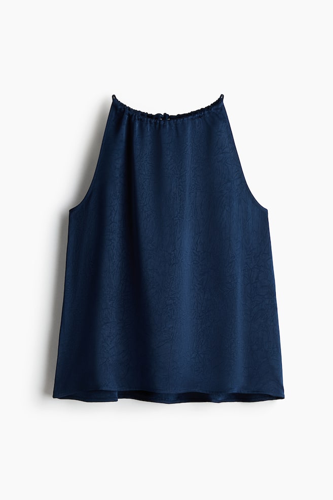 A navy blue sleeveless top is showcased at the front, featuring a gathered high neckline with a drawstring channel, an all-over crinkled texture, and a relaxed, A-line fit. - 1