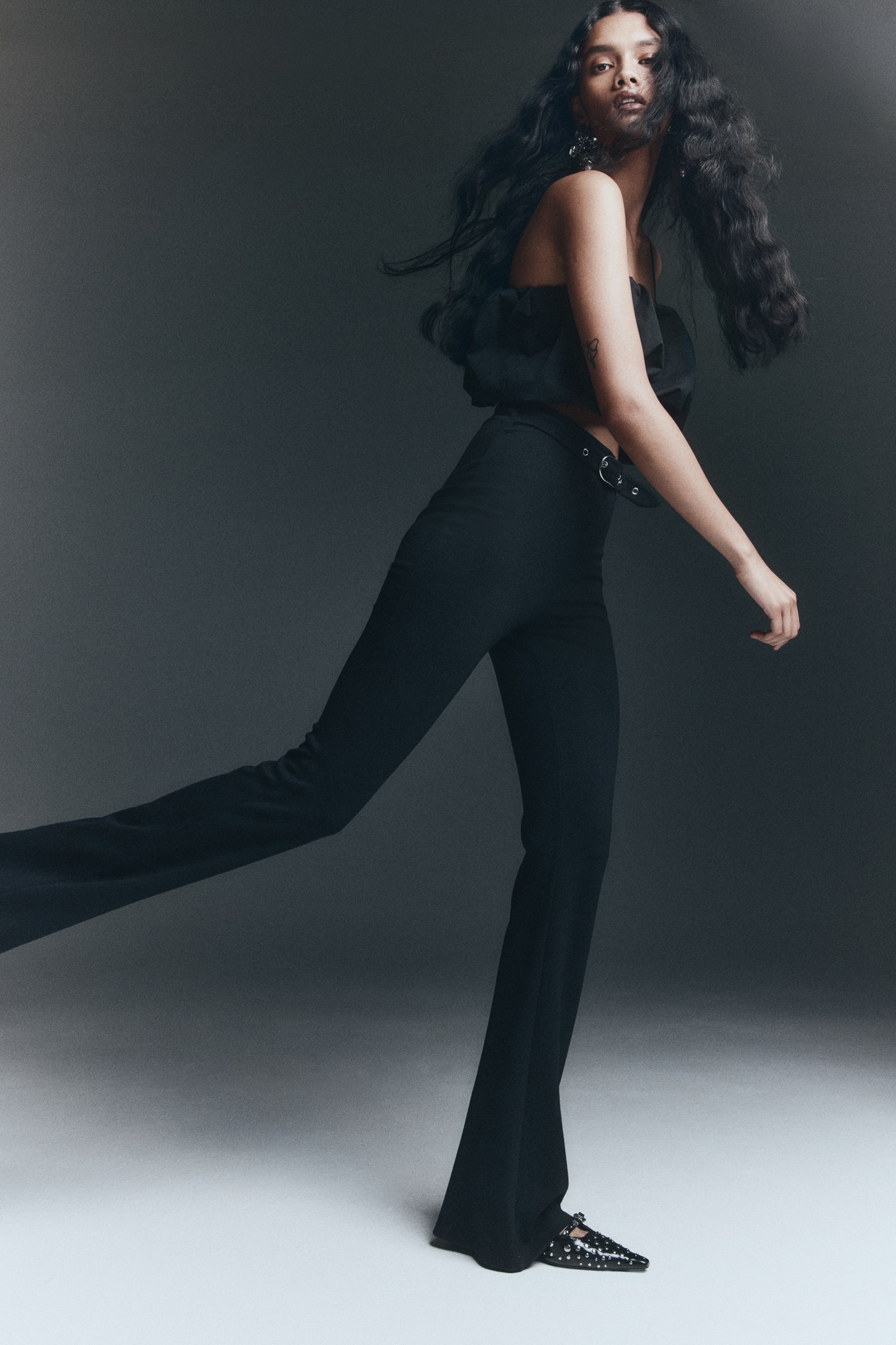 Flared belt-detail trousers