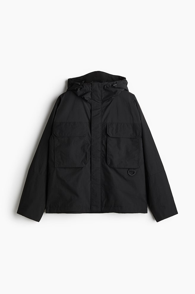 Wasserabweisende Windjacke in Loose Fit - Schwarz/Dunkelbraun - 1