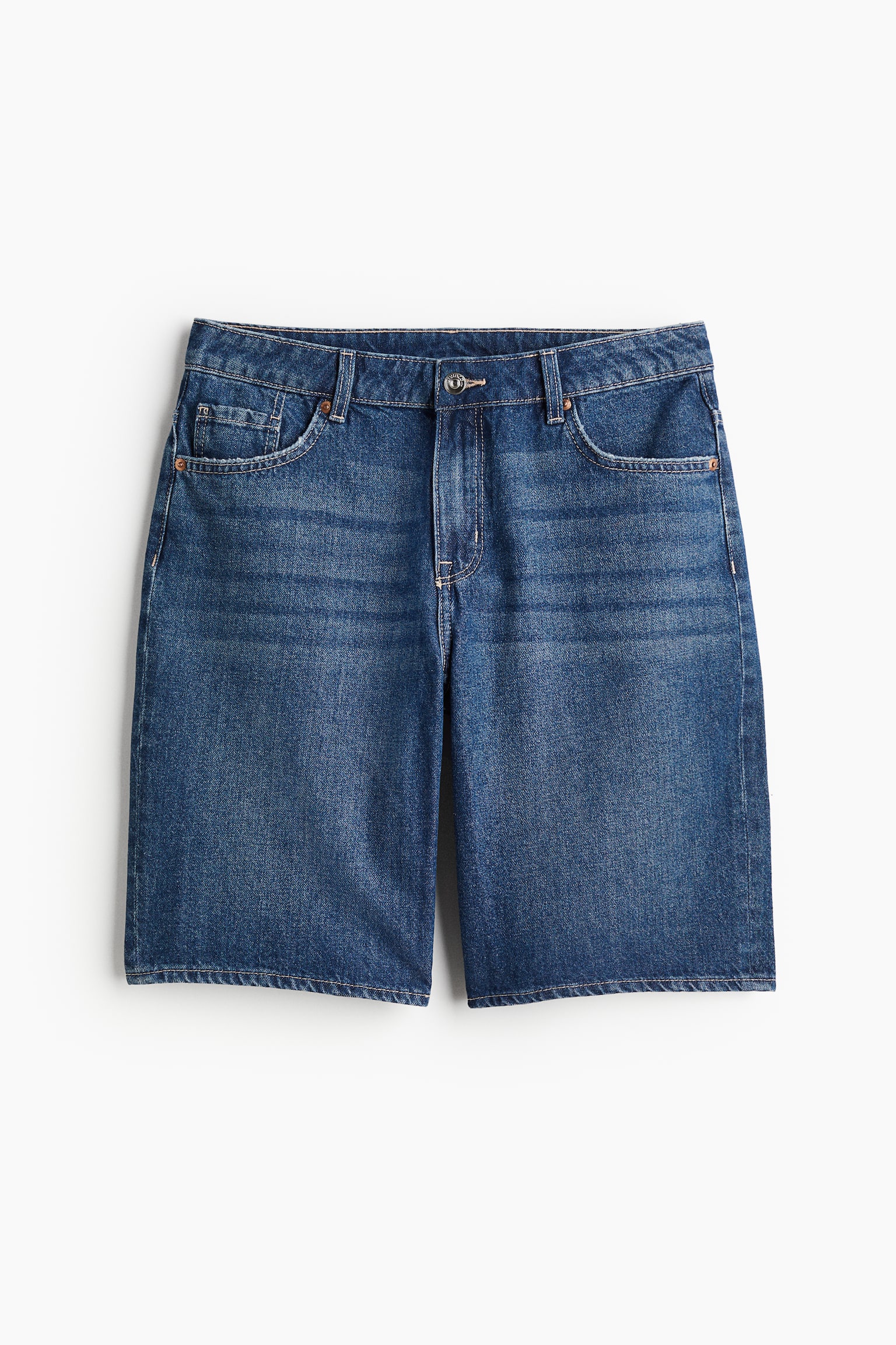 H&M 5-pocket shorts in rigid cotton denim that feels firm at first but then softens and loosens with wear. Low waist with a zip fly and button.