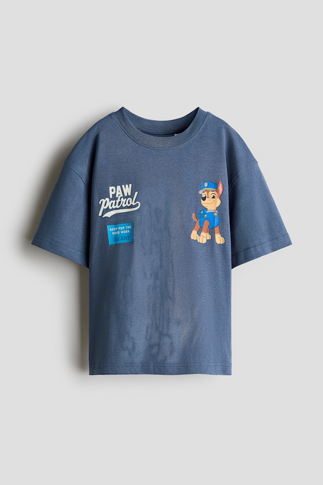 オーバーサイズ プリントTシャツ - ダスティブルー／パウ・パトロール/クリーム／ホットウィール/グレーメランジ／Batwheels/ライトダスティグリーン／Minecraft/ダークグレーメランジ／Marvel Comics/ホワイト／FIFA World Cup 2026™/ダスティターコイズ／ポケモン - 1