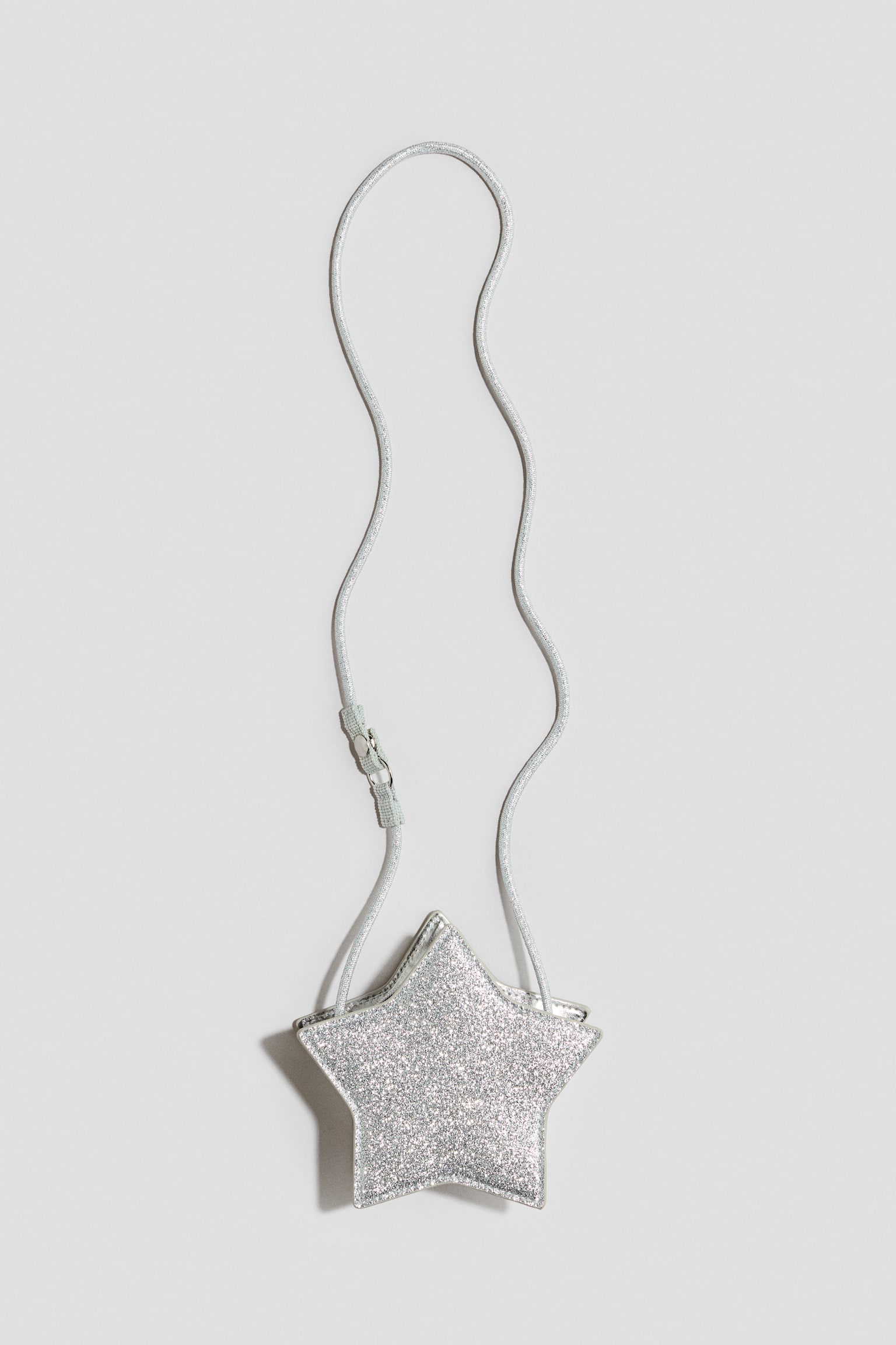 Glittrig crossbody-väska