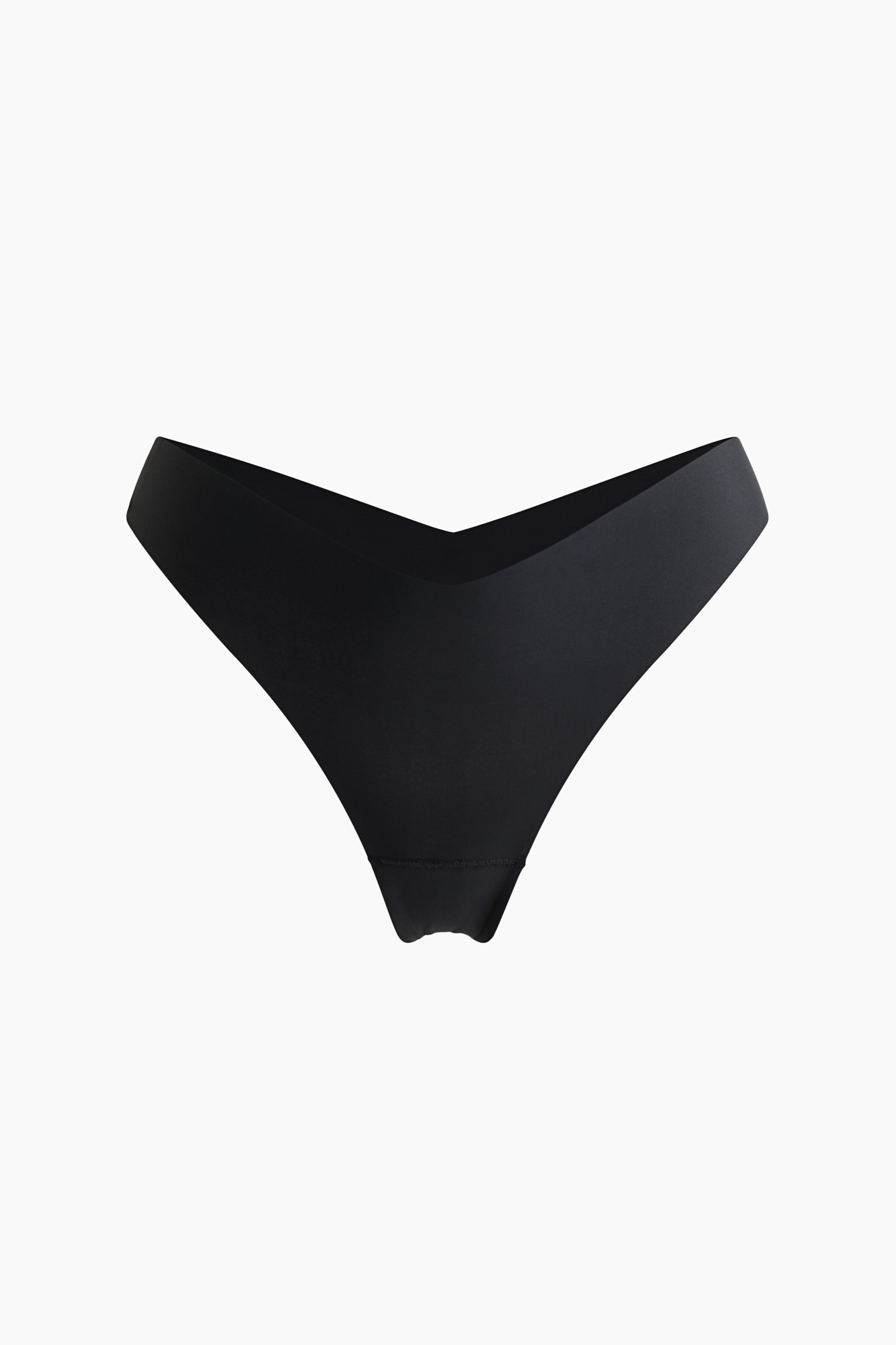 View larger image: The front view showcases a black thong brief, characterized by a low, V-shaped waist and sleek, unhemmed edges.