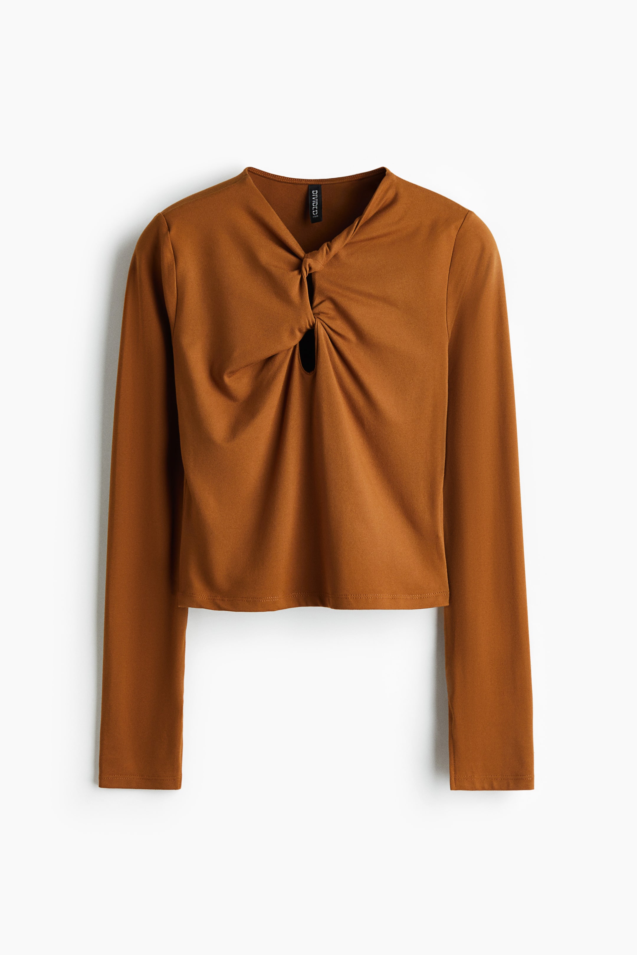 View larger image: A front view of a rust-colored long-sleeved top is featuring a twisted knot detail at the center chest, forming a V-neckline and a small keyhole cutout directly below it.