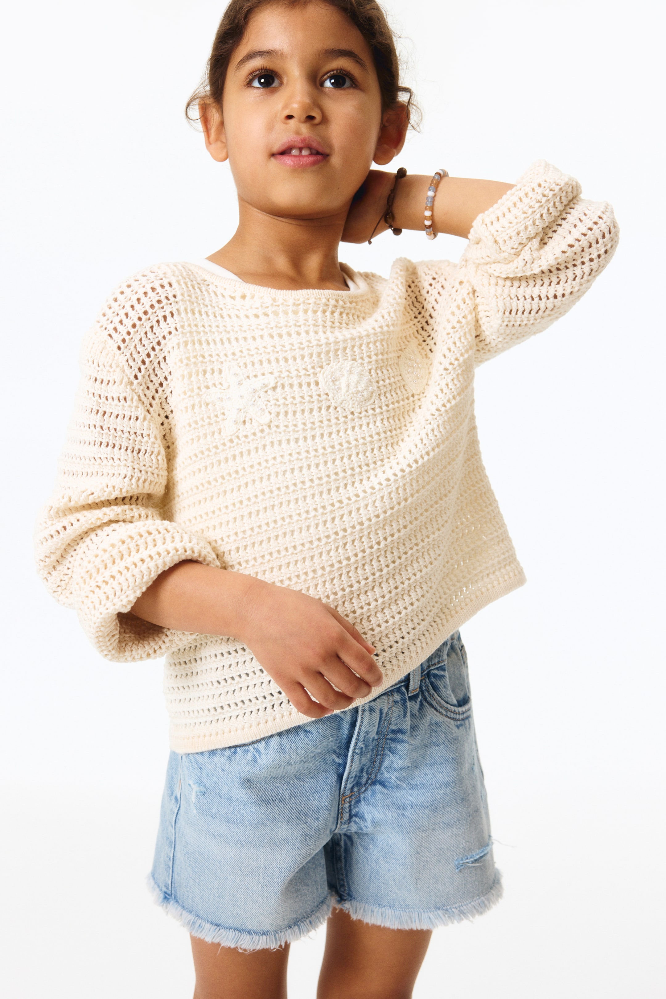 Short frangé en denim