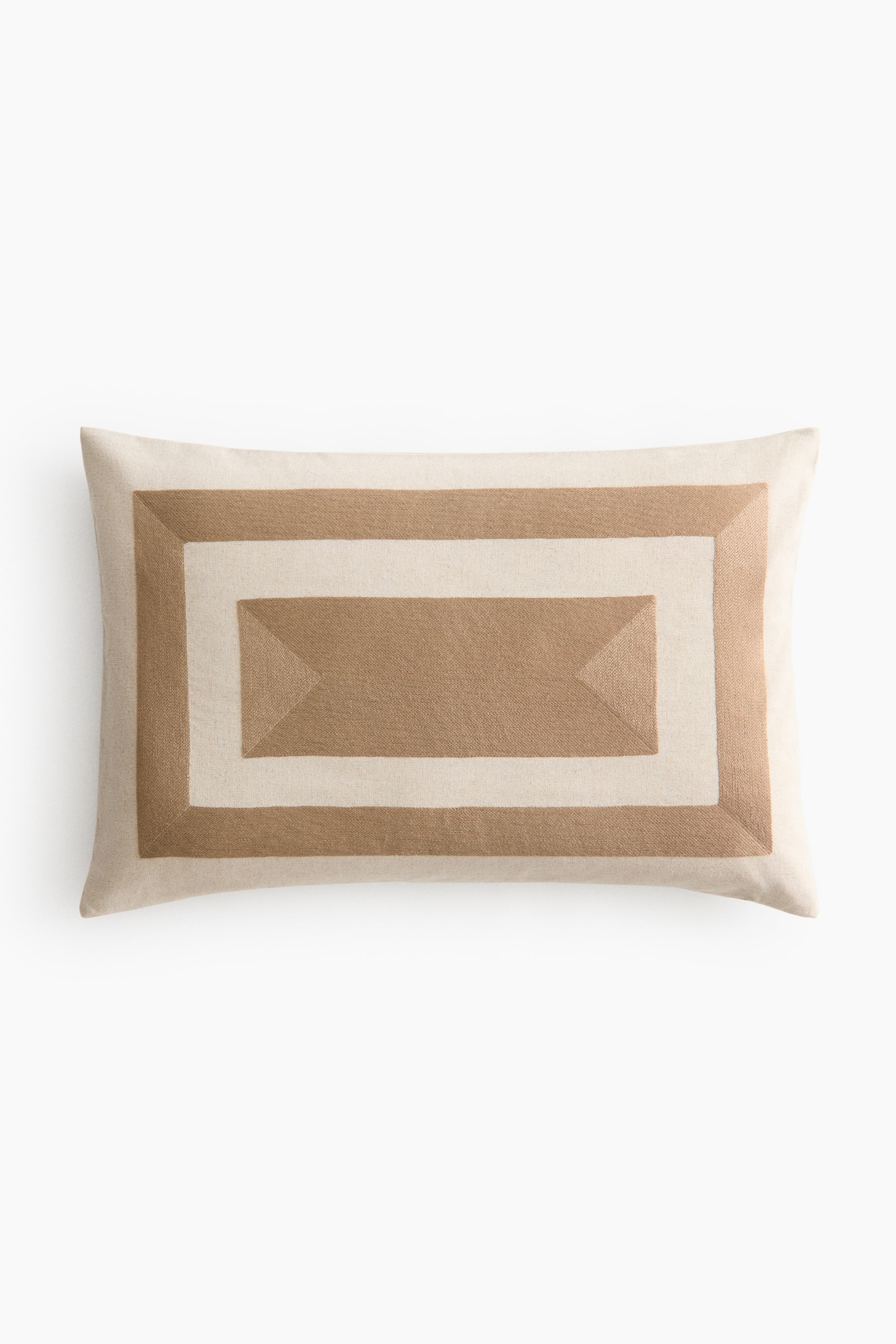 View larger image: A rectangular cushion cover is showcasing its front, crafted from a rustic linen and cotton blend weave. It features an embroidered graphic pattern of concentric rectangles in off-white and tan colours.