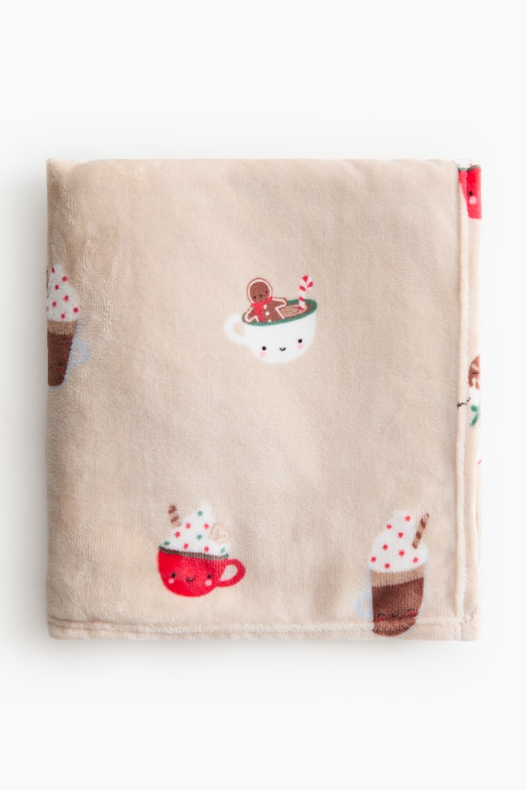 Plaid en polaire à motif