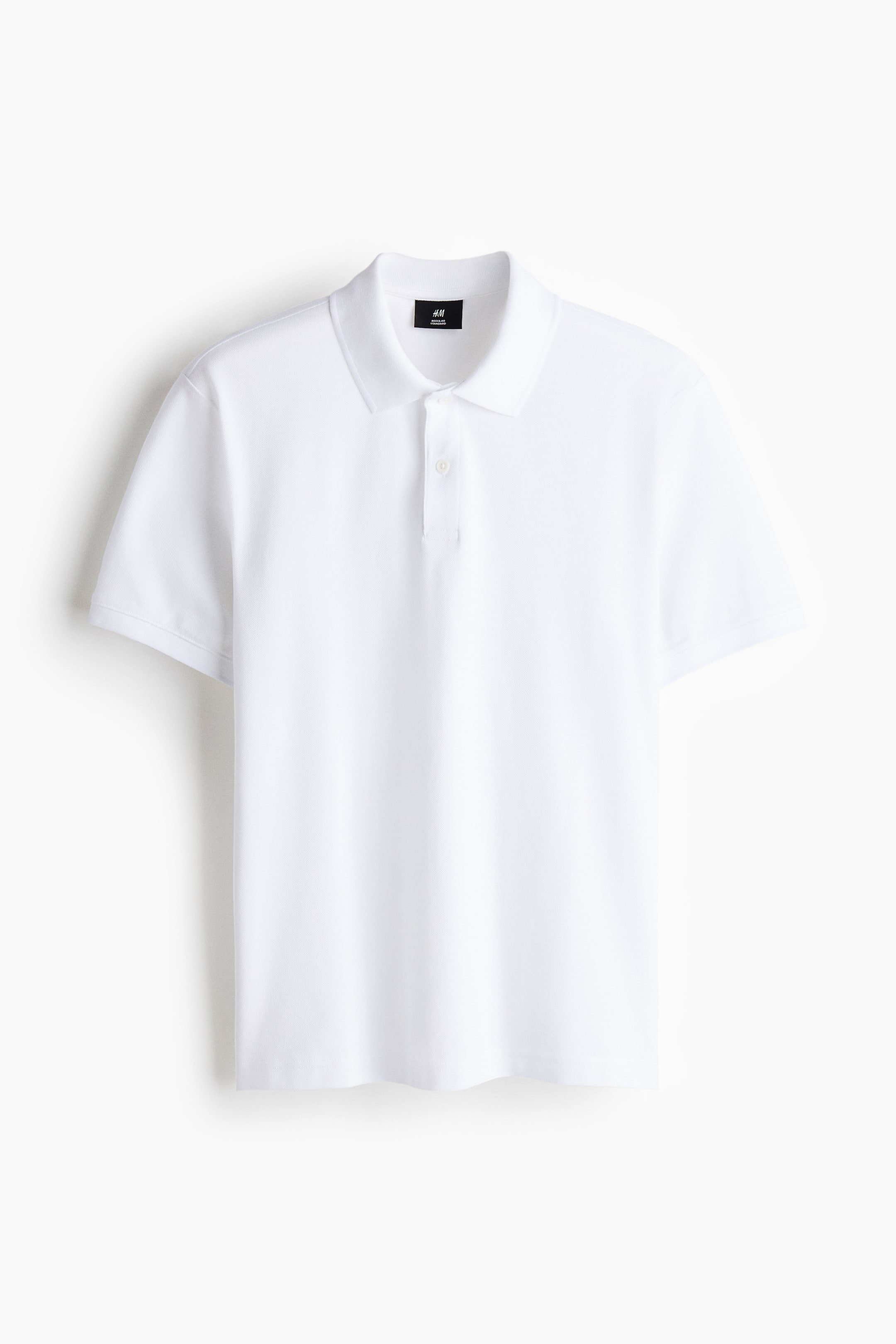 View larger image: A white polo shirt is presented front-facing, featuring a pointed collar, a two-button placket with white buttons, short sleeves, and a straight hem.