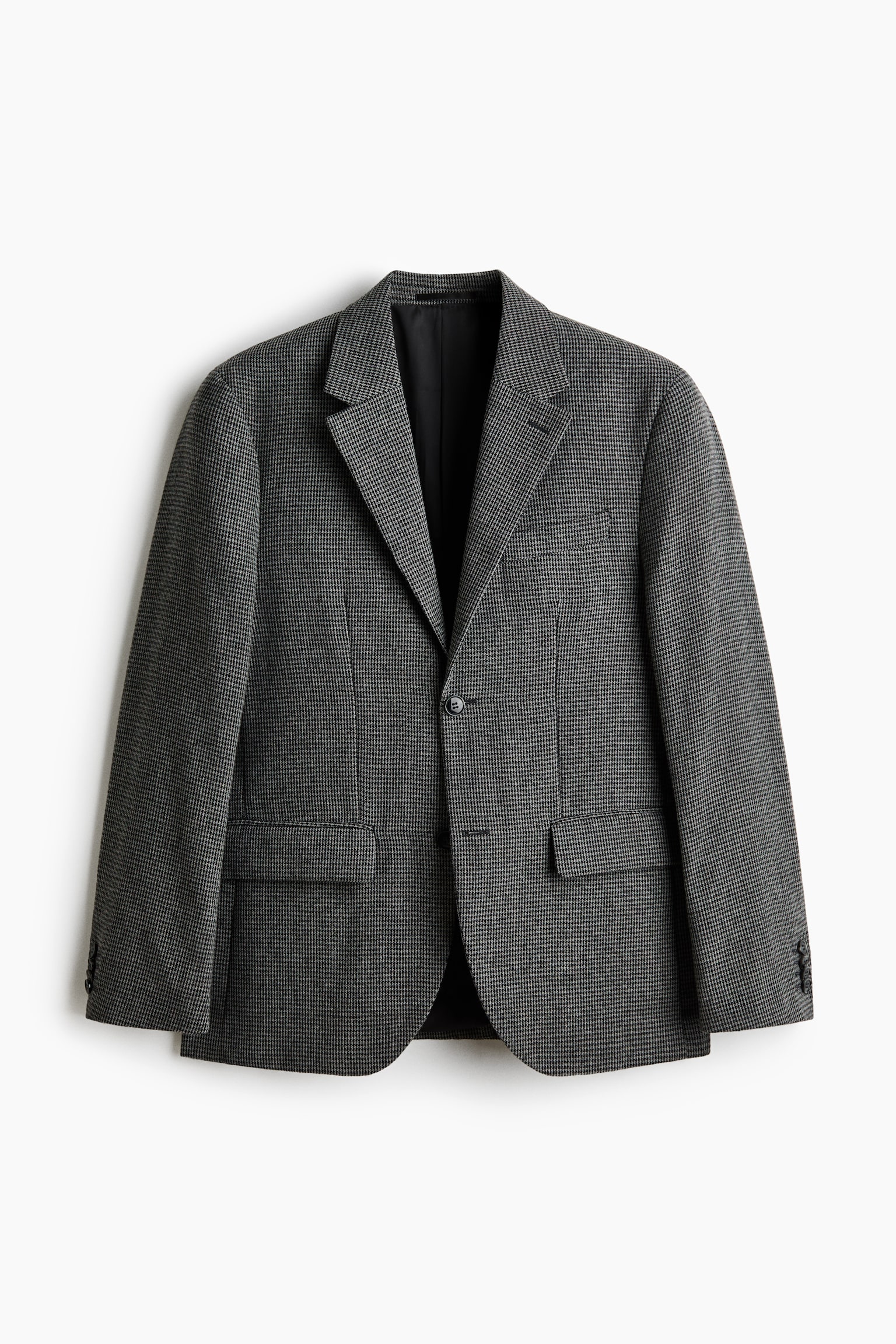 A grey and black houndstooth blazer is shown from the front, featuring notch lapels, a single-button closure, a welt chest pocket, and two flap pockets. Each sleeve cuff is displaying three buttons. - 1