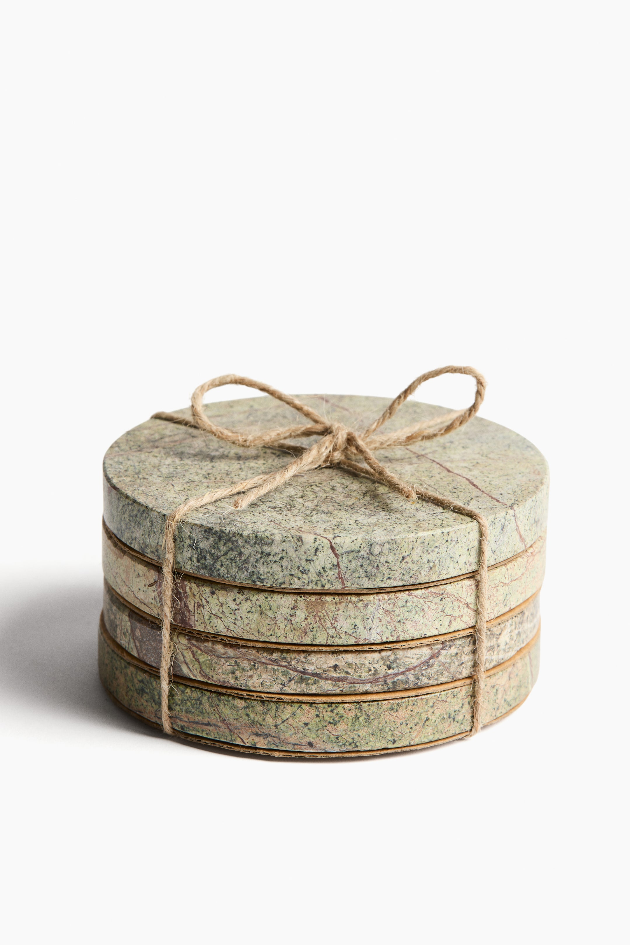 View larger image: A 4-pack of round marble coasters, 10 cm (≈3.9 in) in diameter, is stacked and shown from the front. Each coaster displays a greenish-gray color with reddish-brown veining, and the stack is tied with a natural jute string, finished with a bow on top.