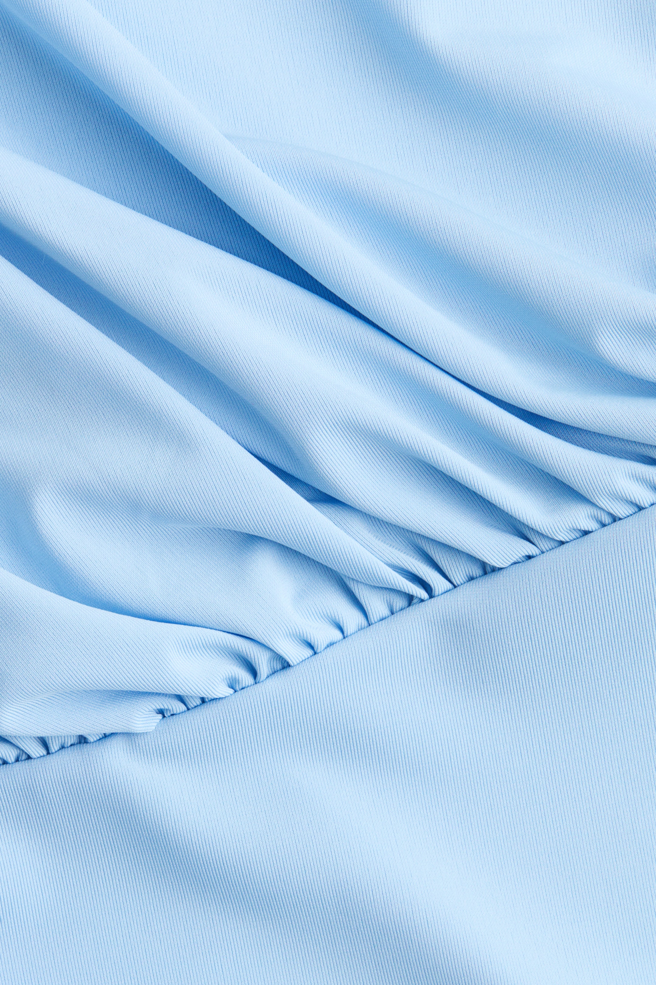 Haut asymétrique à effet drapé